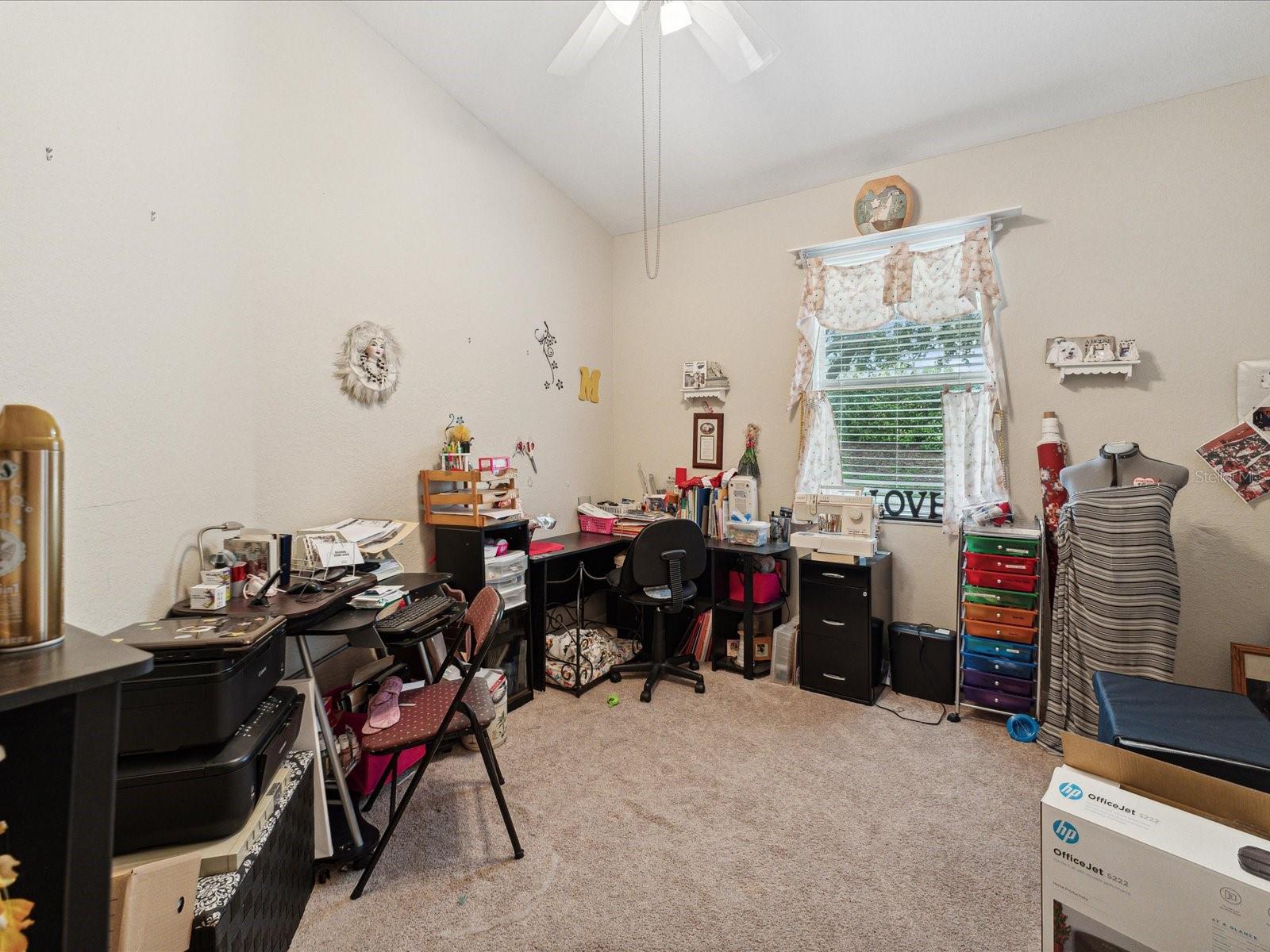 The second bedroom is well appointed with a connecting bathroom and an abundance of space for a bed or in this case, a hobby room!