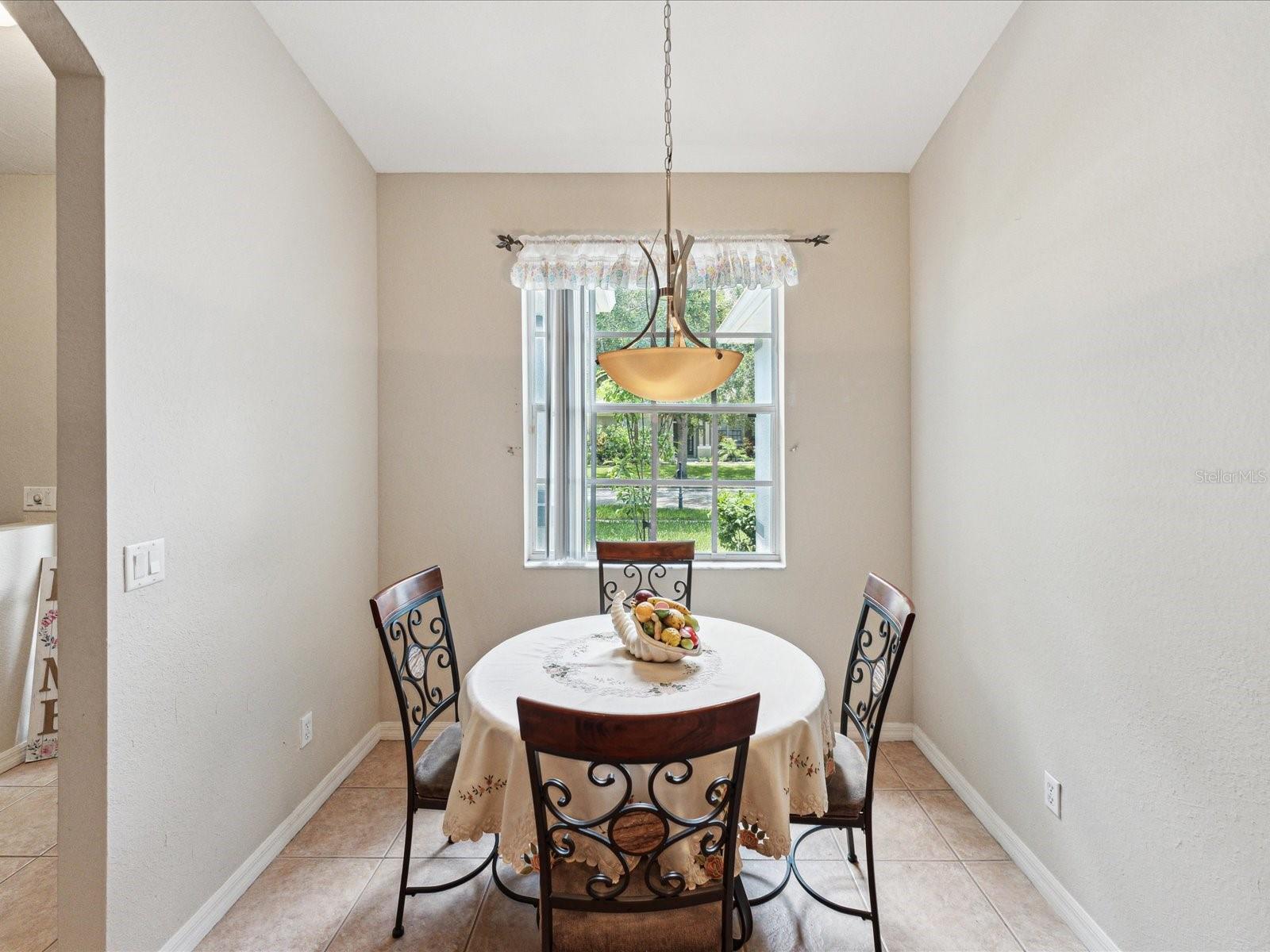 Sunlight streaming in the breakfast nook make a perfect place for you to enjoy a cup of coffee or casual dining.