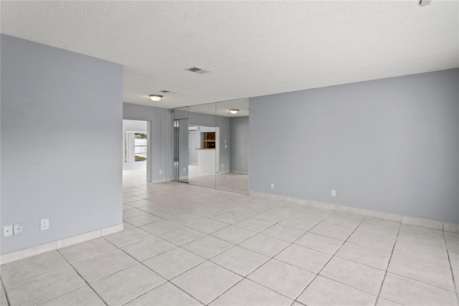 Living Area opens to Dining Area, lots of space to visit & entertain.