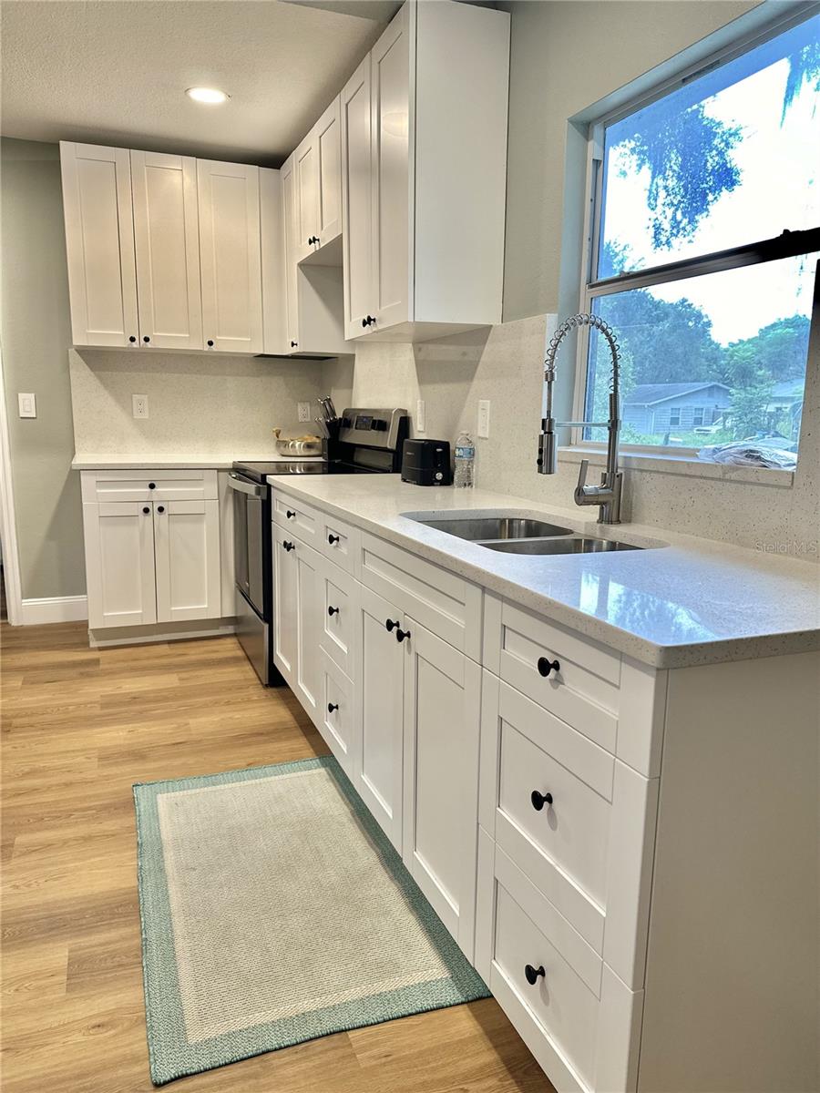 Let the sun shine in! Cheery, light and bright kitchen!