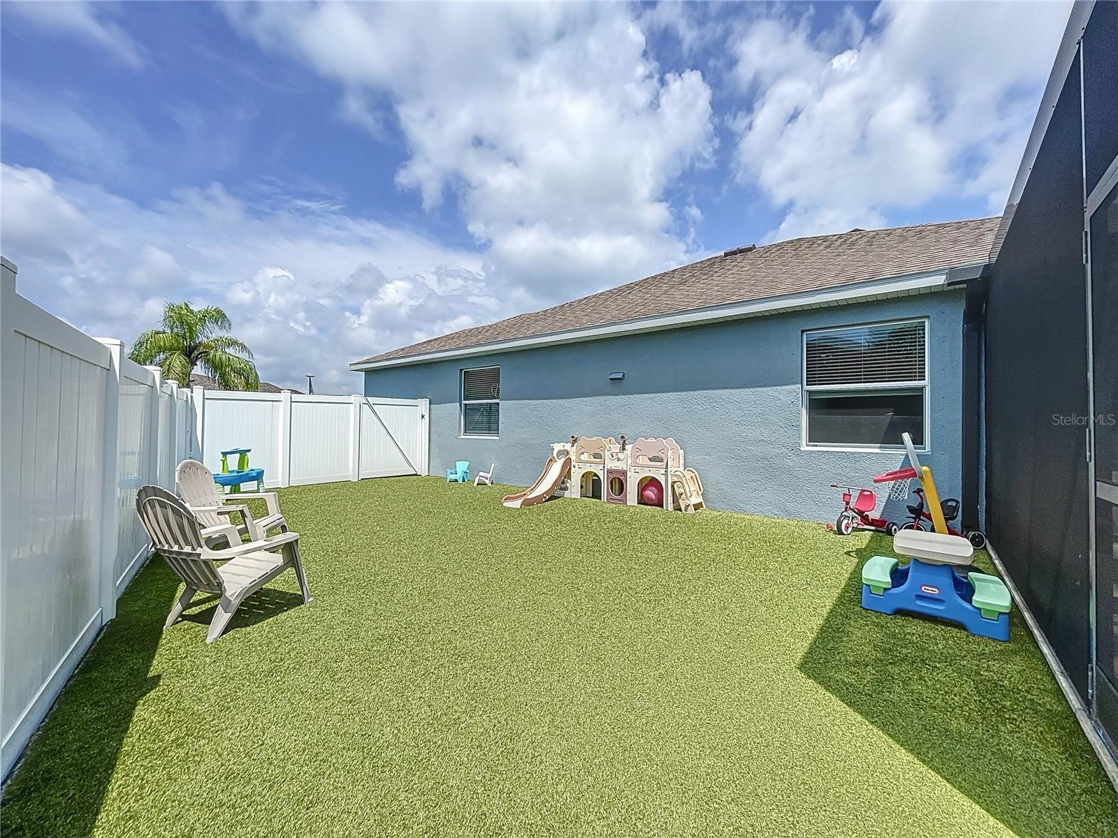 Enclosed side yard with astro turf