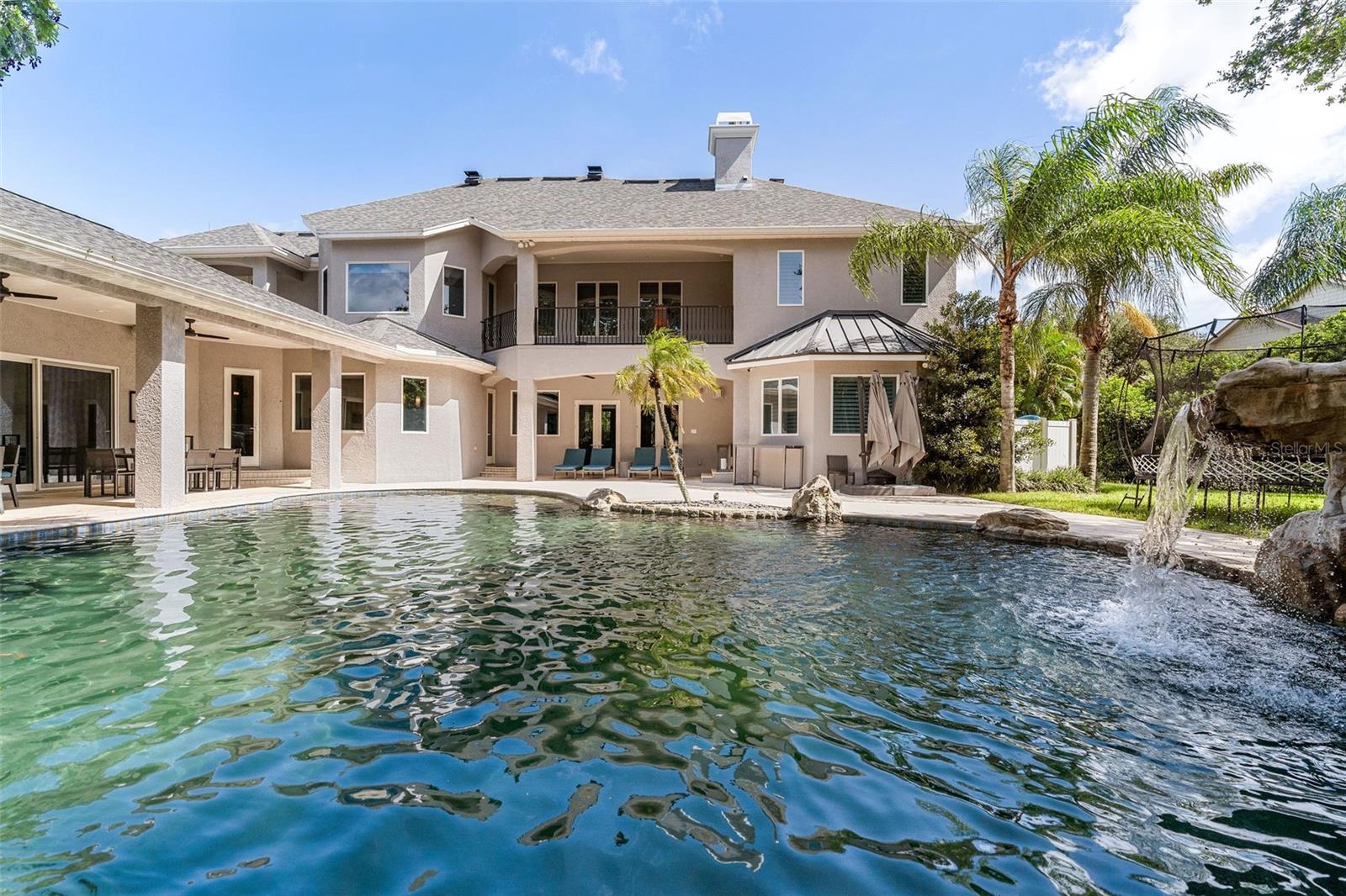 Waterfall on the right and expanse of the pool area