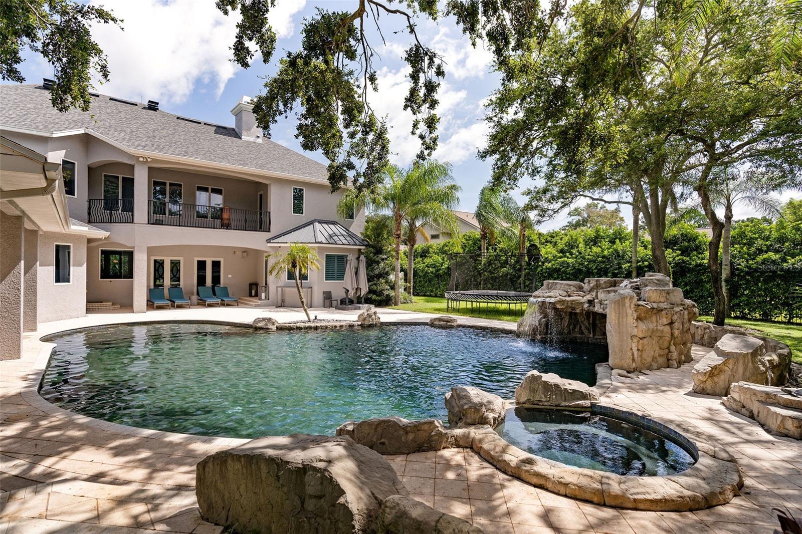 Another view of the spa, waterfall and pool