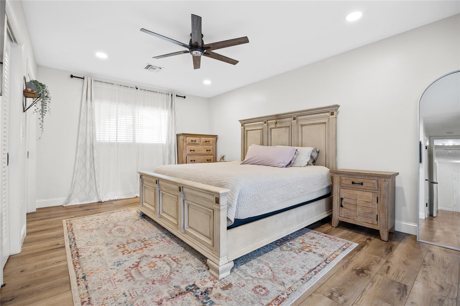 The Primary Bedroom is spacious and has recessed lighting and a ceiling fan.