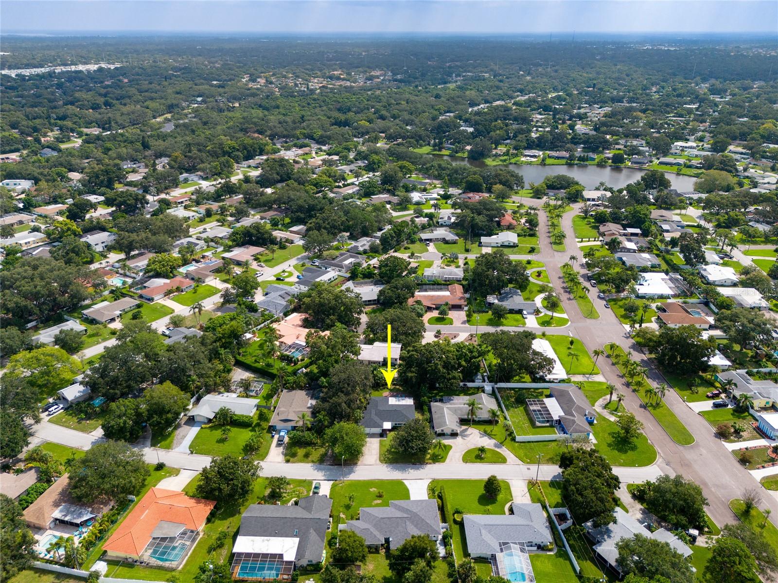 This aerial view looking a bit Northeast shows Fairway Estates very own Lake Saundra.    There is a lovely park with benches and a picnic table where neighbor spend time socializing and/or admiring the abundant flora and fauna.