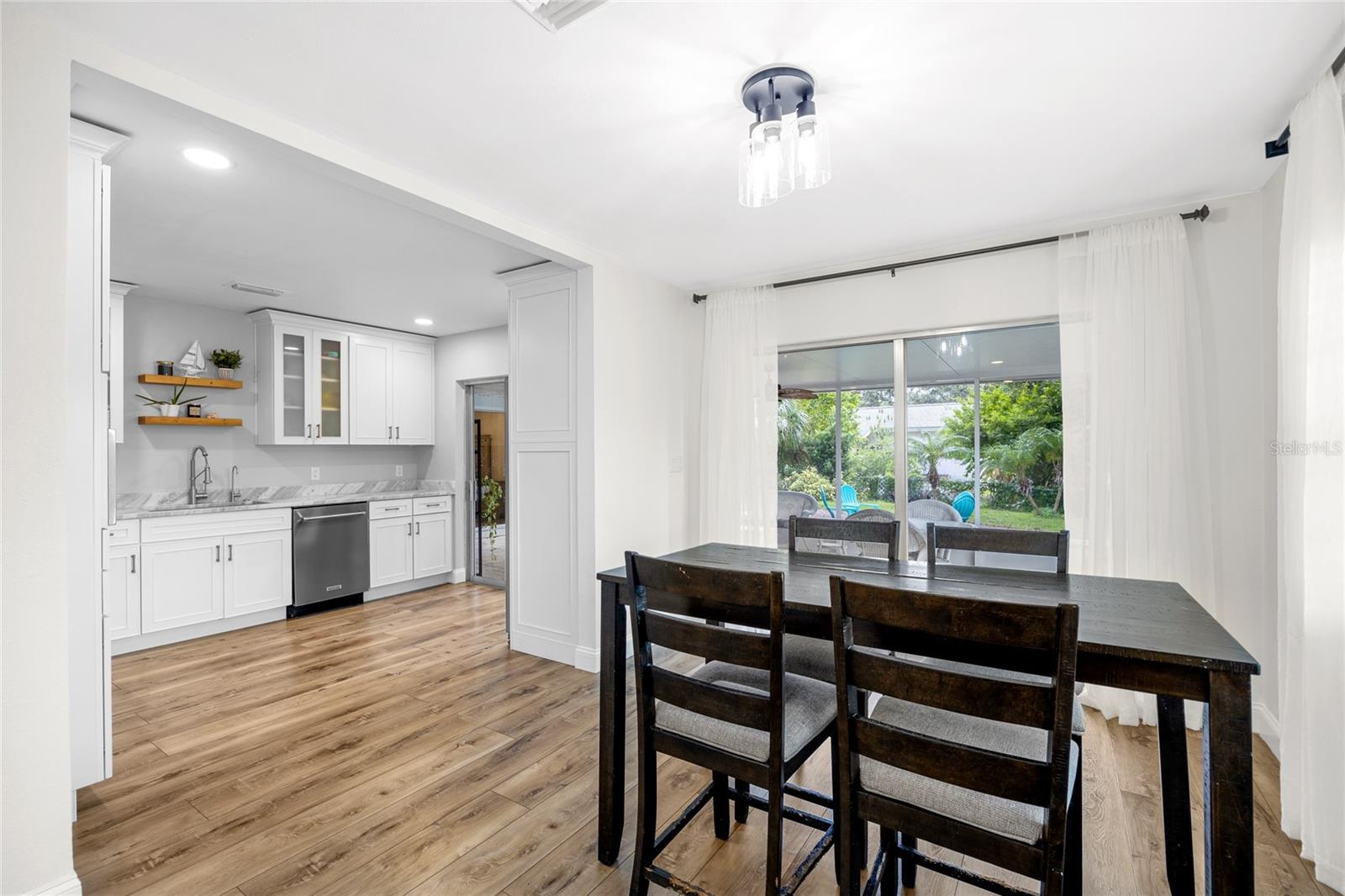 The Dining Room is conveniently located right off of the Kitchen and also has sliding doors out to the MASSIVE Lanai.