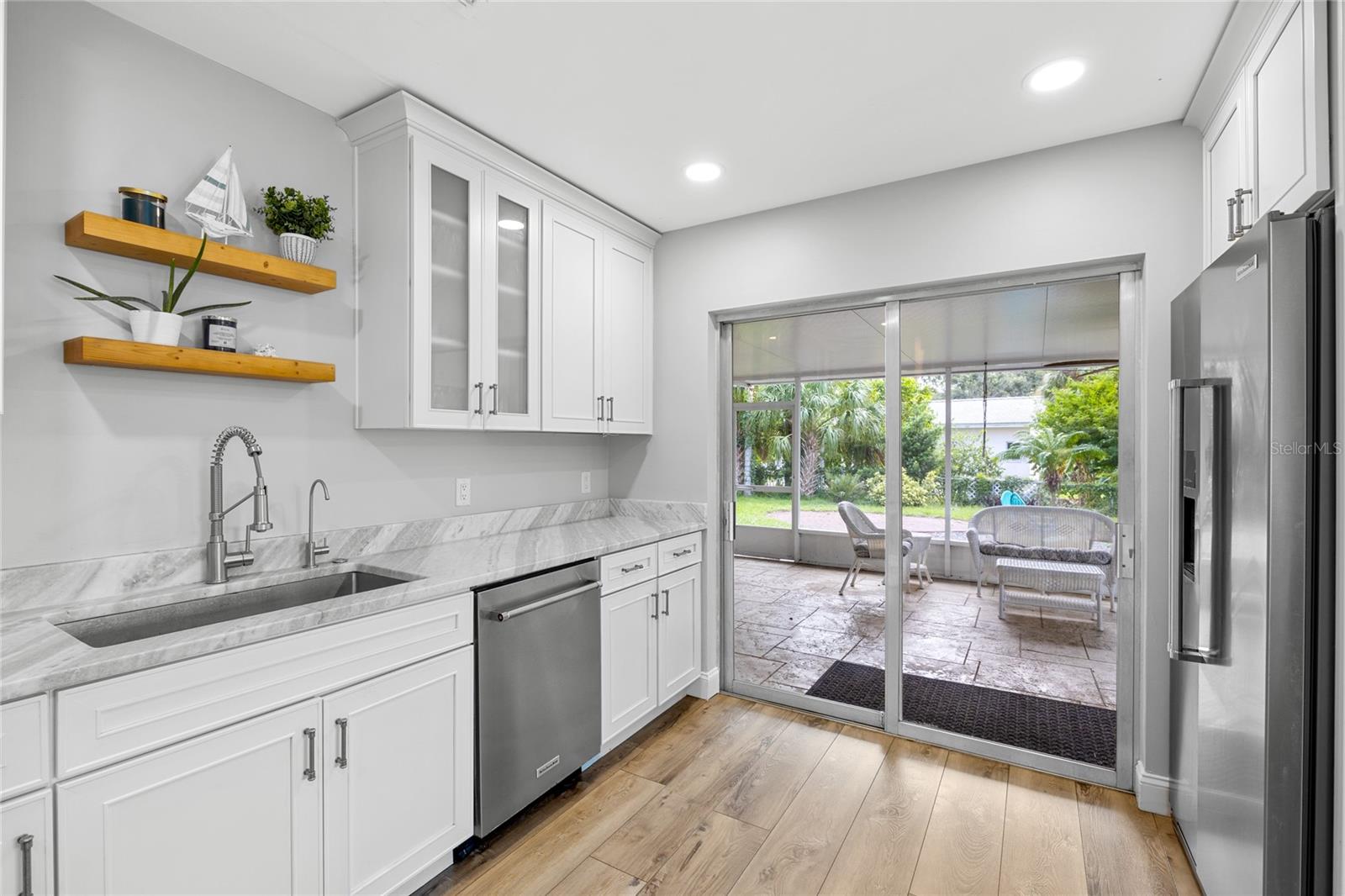 Sliding doors off of the Kitchen provide convenient access to the Lanai and back yard, perfect for entertaining.