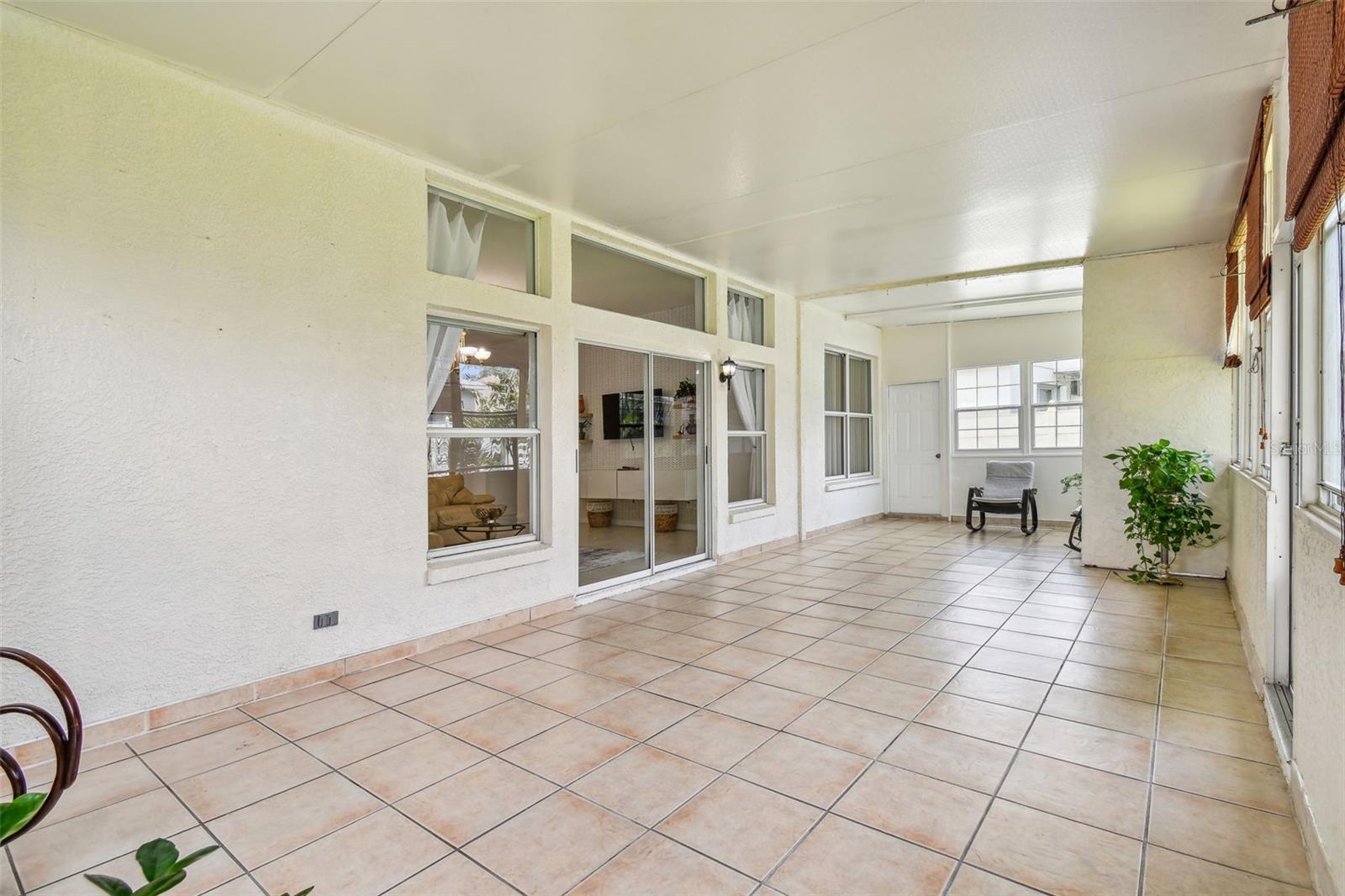 Sunroom with tile flooring