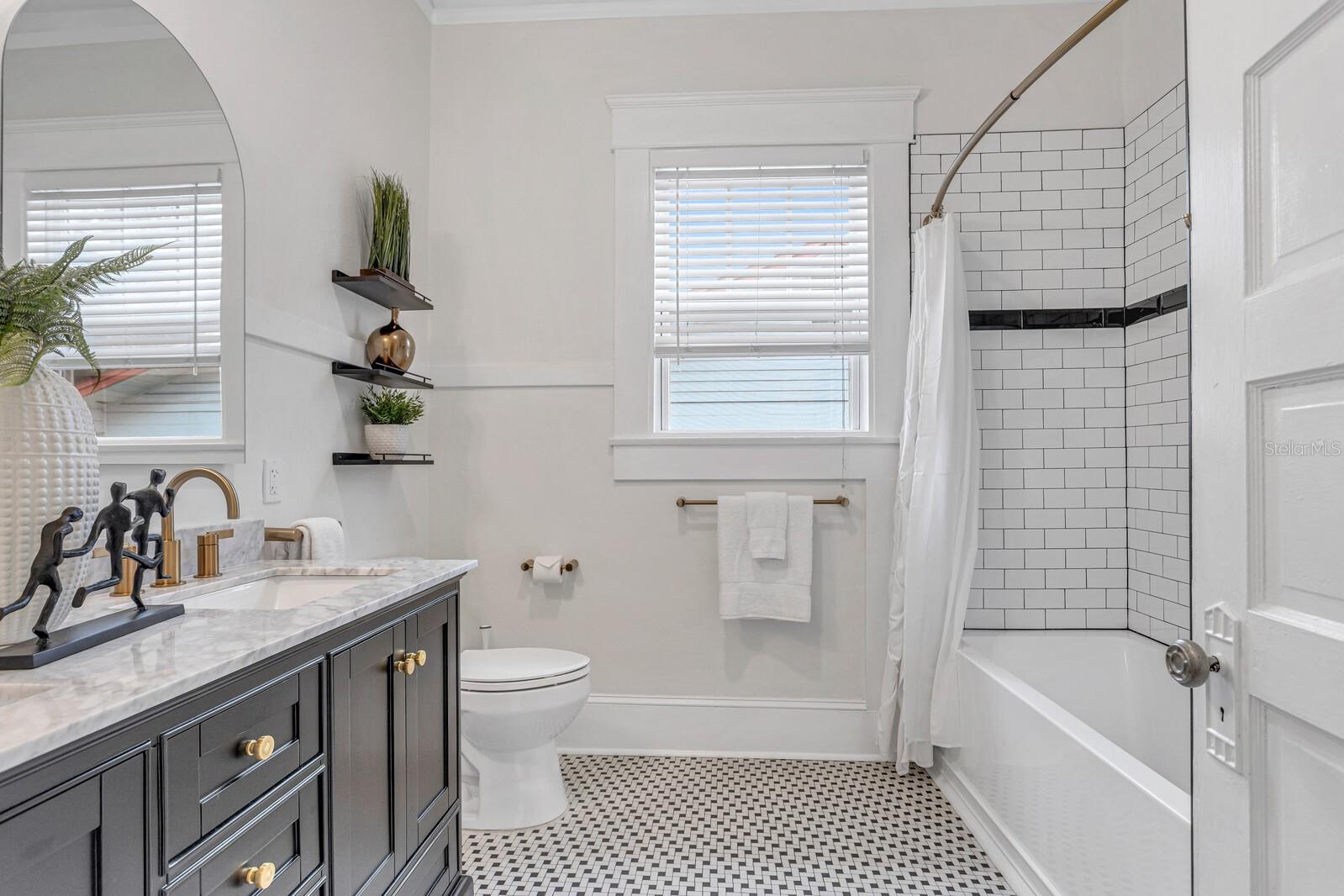 Primary bath with original tile floors