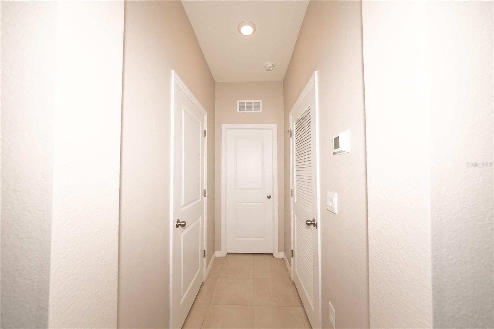 Hallway to Bedroom 3, Powder Room and HVAC Room