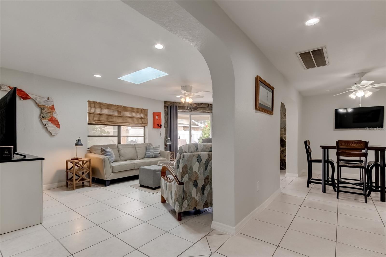 View from front entrance into Left is living and kitchen to right