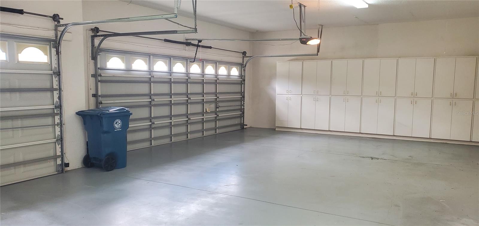 3 Car Garage w/ Lots of Storage Cabinets