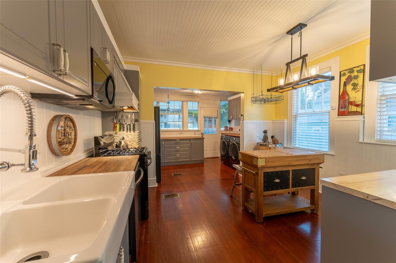 Kitchen with farm sink, butcher block countertops. New Appliances. Lots of cabinet space.