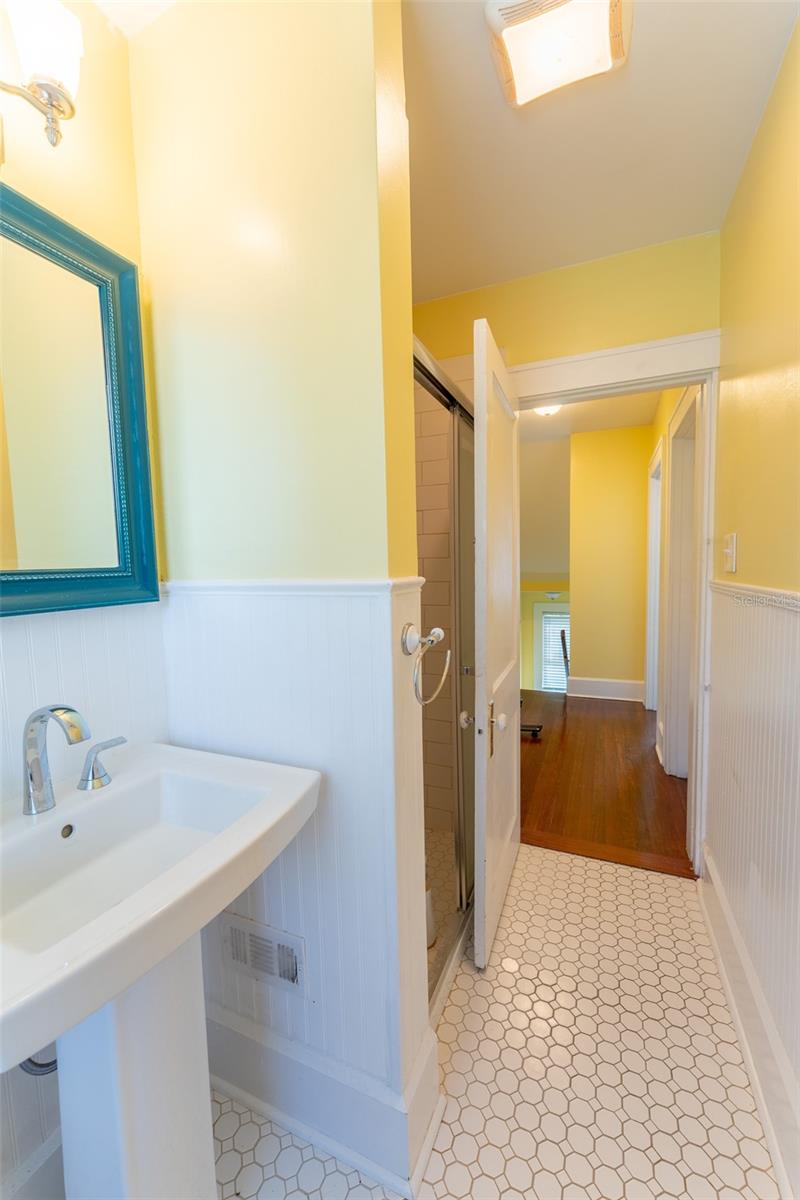 Bathroom 3 Pedestal Sink and shower.