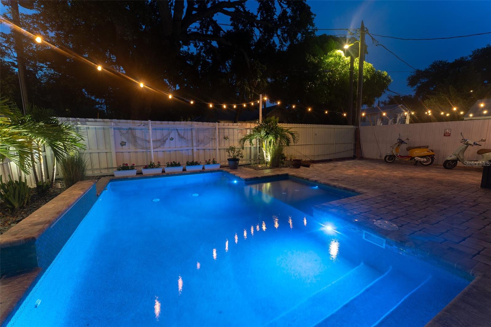 Night View. Built in Pool lights can be changed to multiple colors.