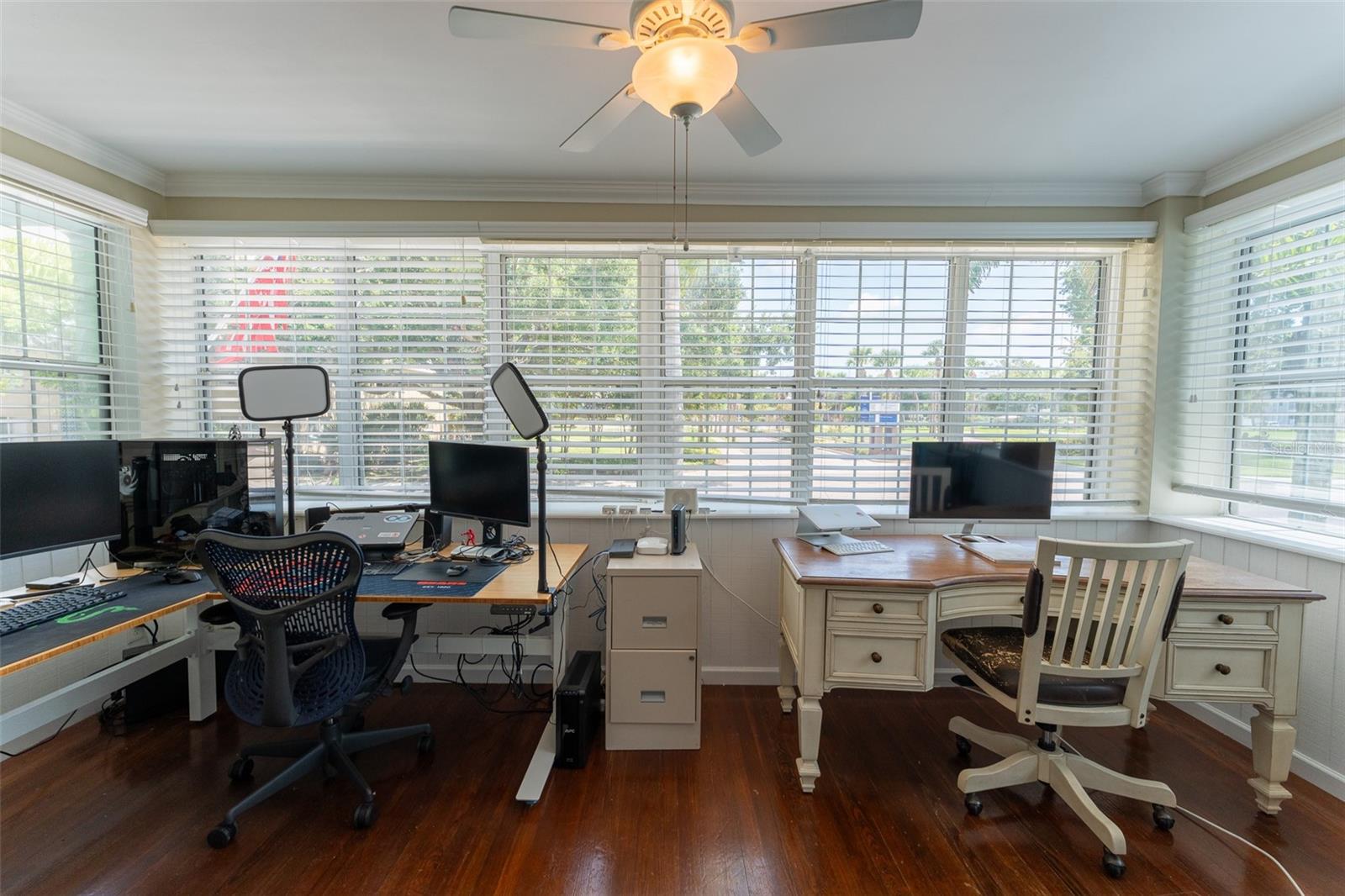 Office located front of the house facing south. French doors.