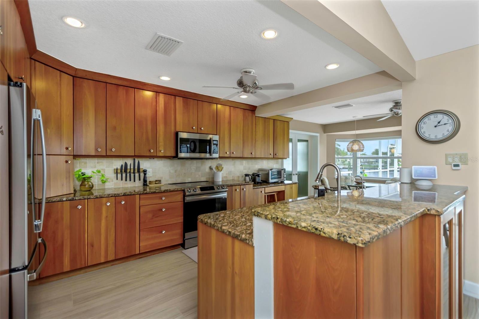 Beautiful kitchen, complete with brand new stainless appliances, granite counter tops and solid cherry wood cabinets.