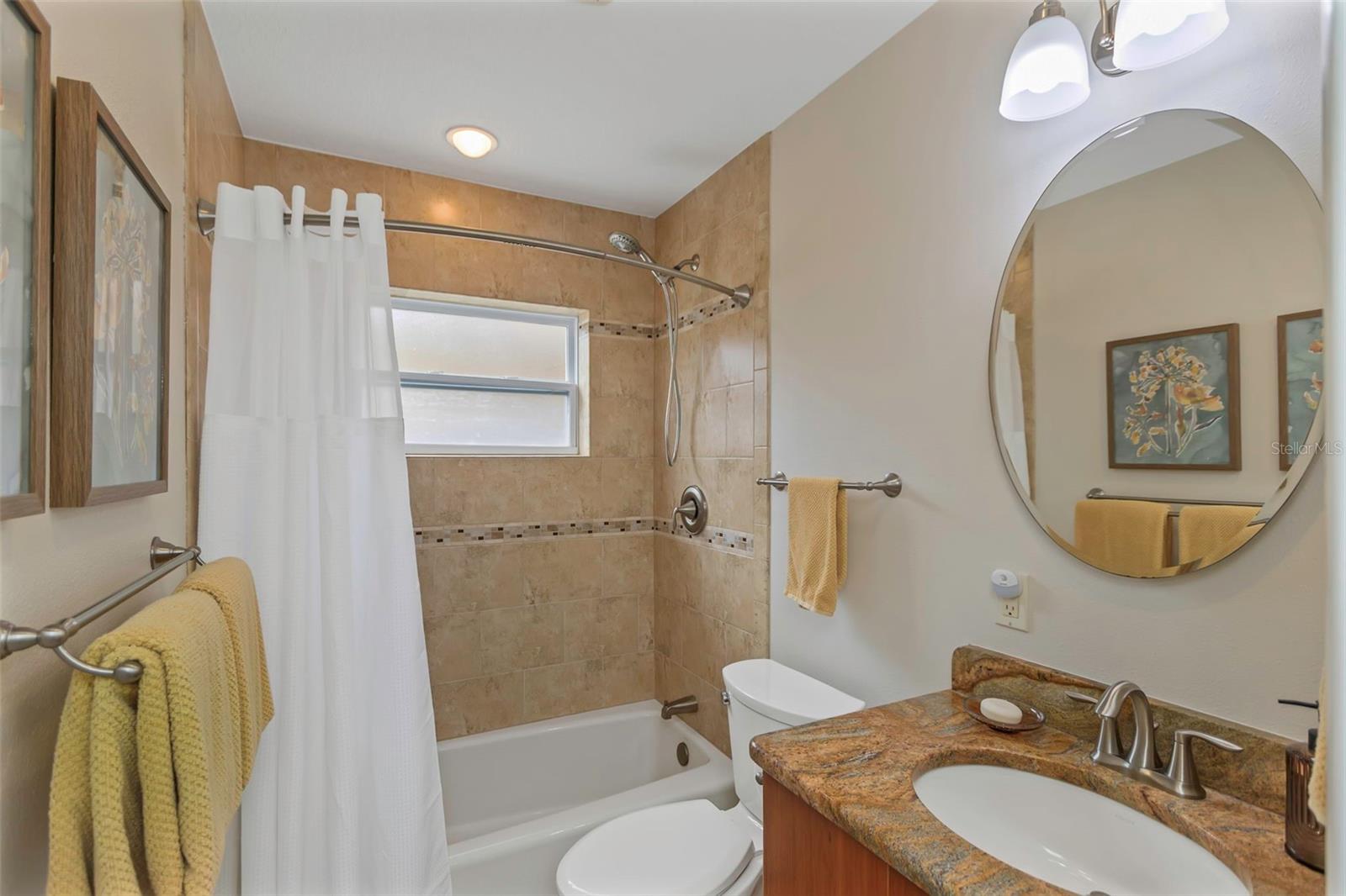 Guest bath includes a shower & tub combination.