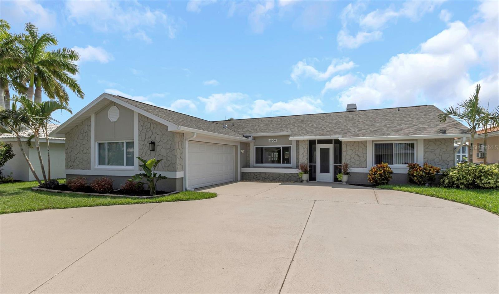 Freshly painted with new textured circular driveway.