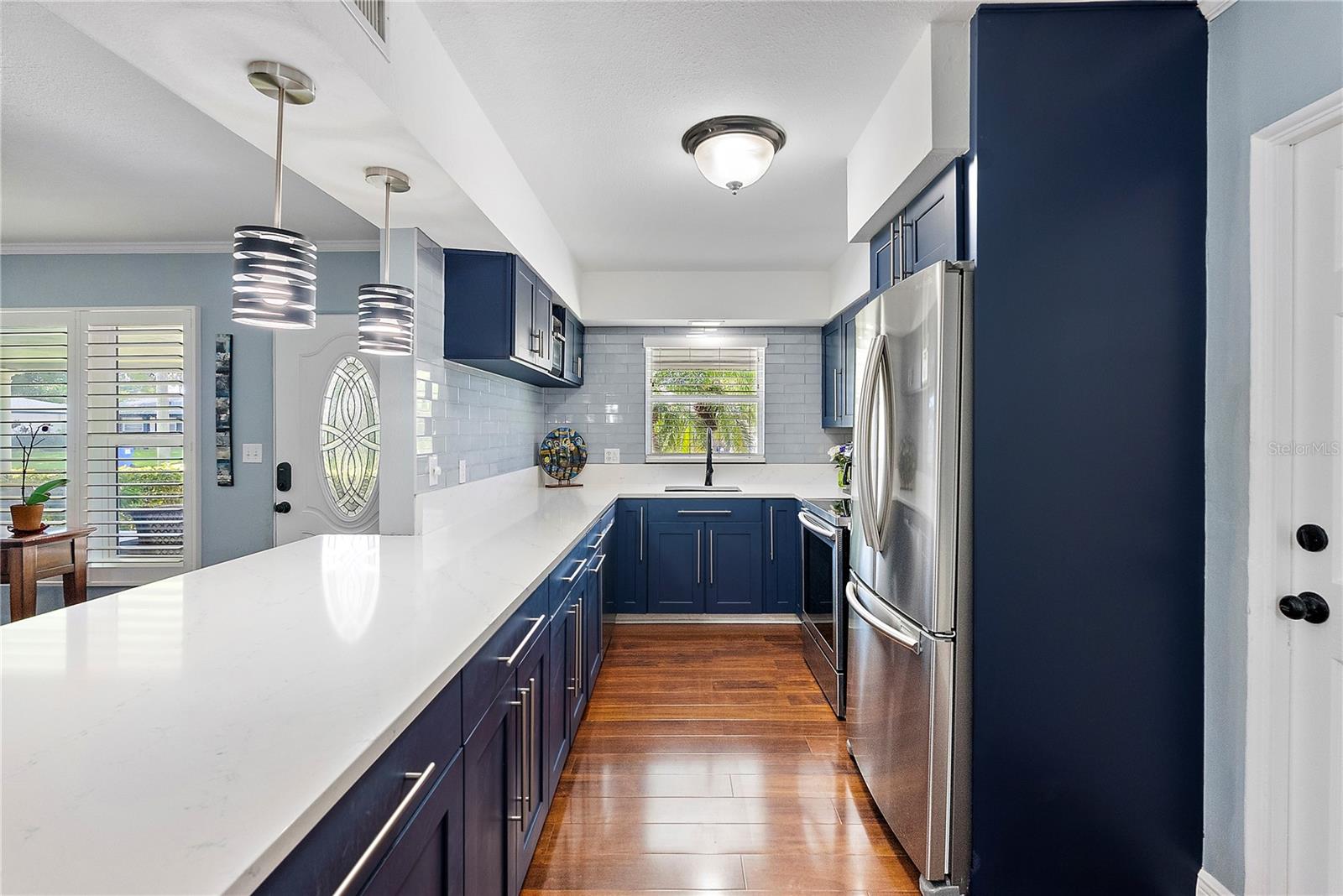 quartz counter / glass tile backsplash