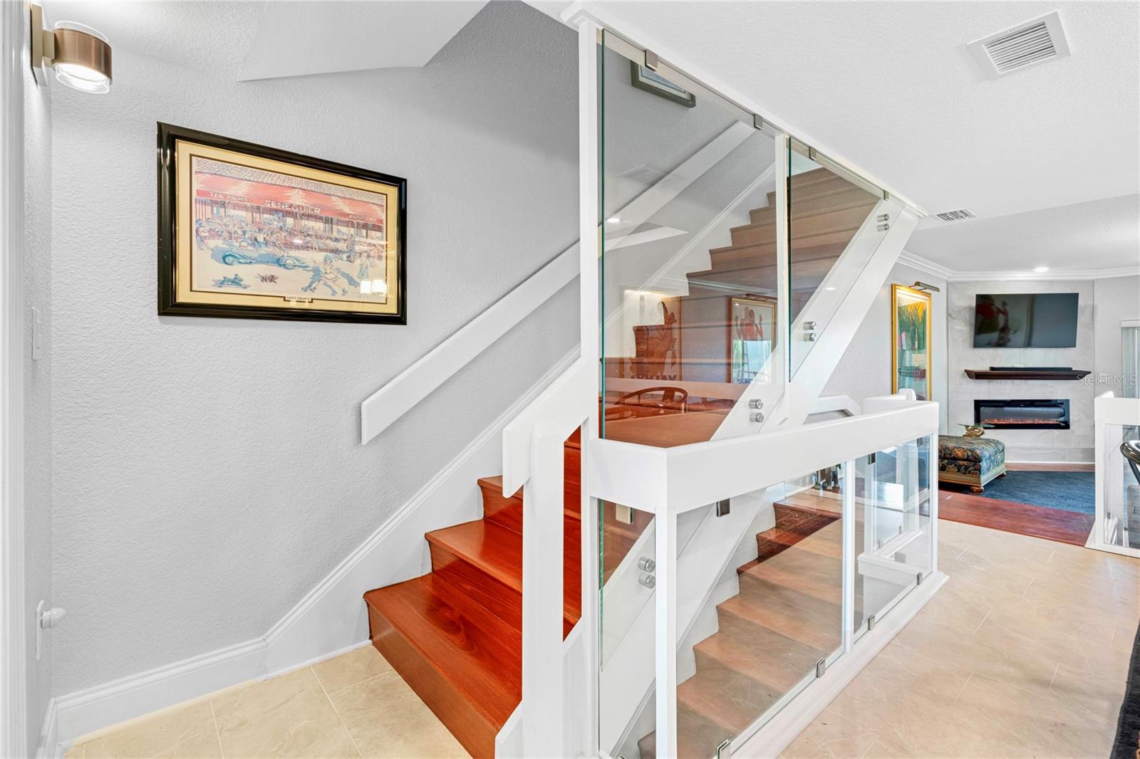 Mahogany stairs towards primary suite