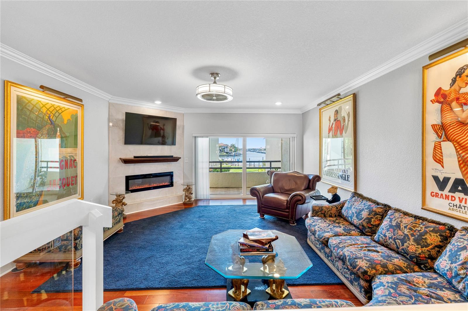 Living room with fireplace and water views