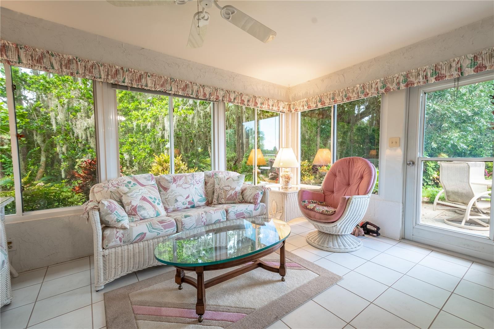 The Florida Room features a ceramic tile floor and ceiling fan for year-round comfort.