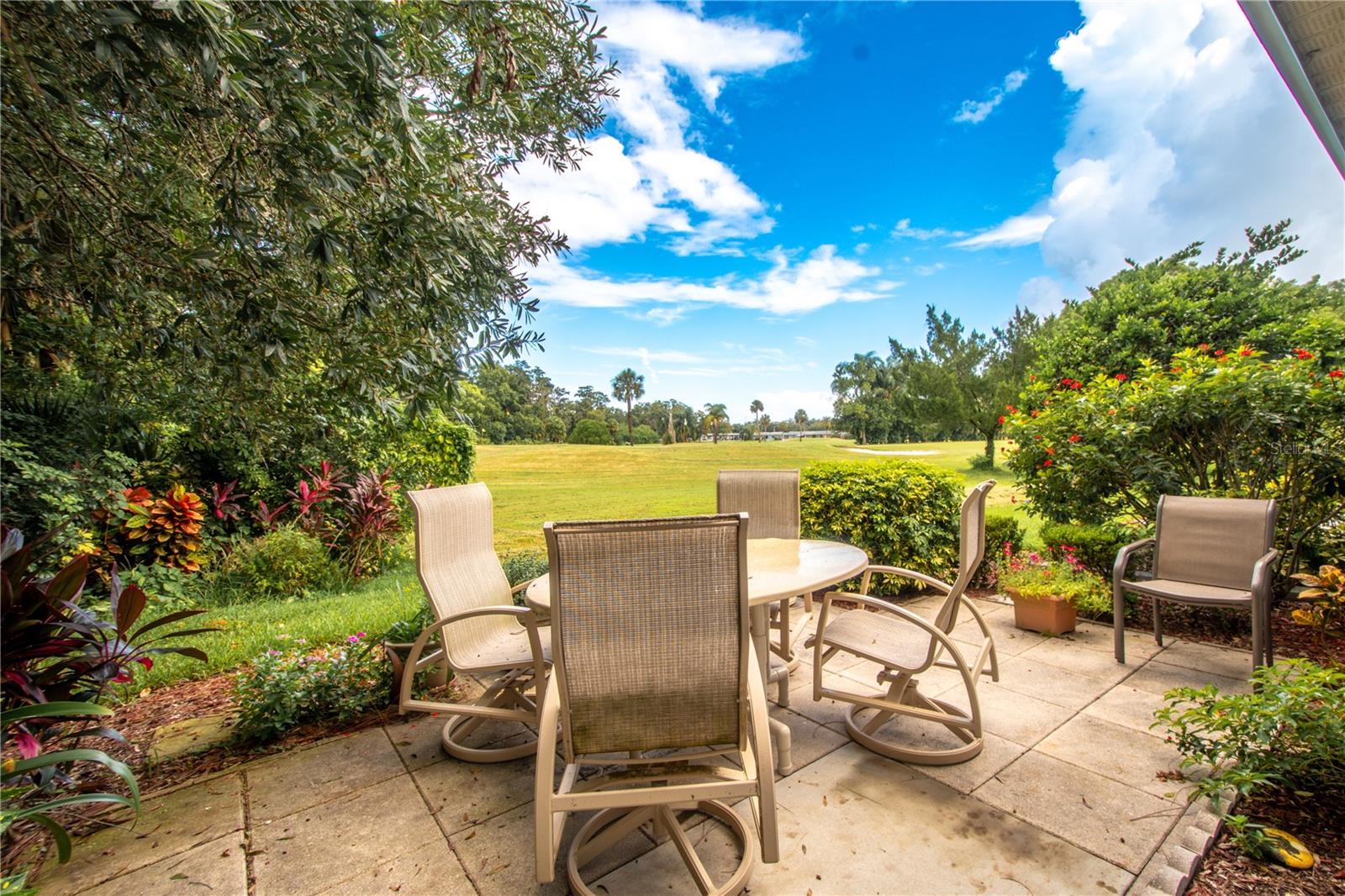 A stone patio with a view of the 14th green on the executive course.