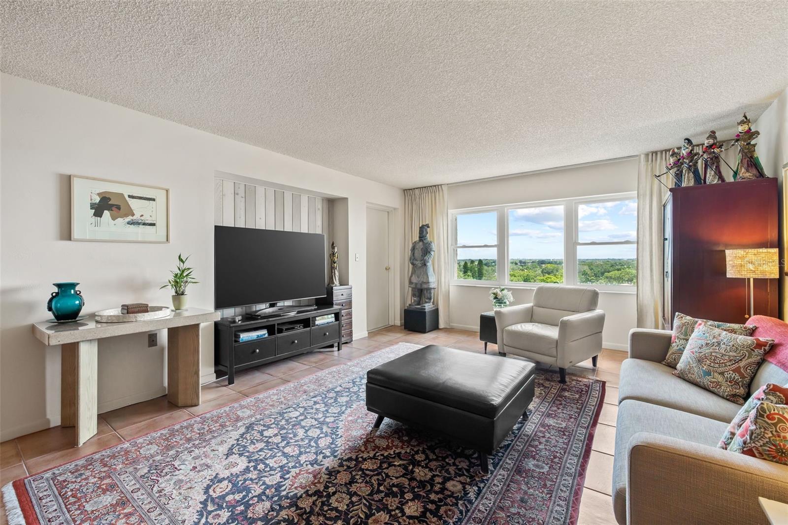 The door to the right of the TV leads you to the balcony.