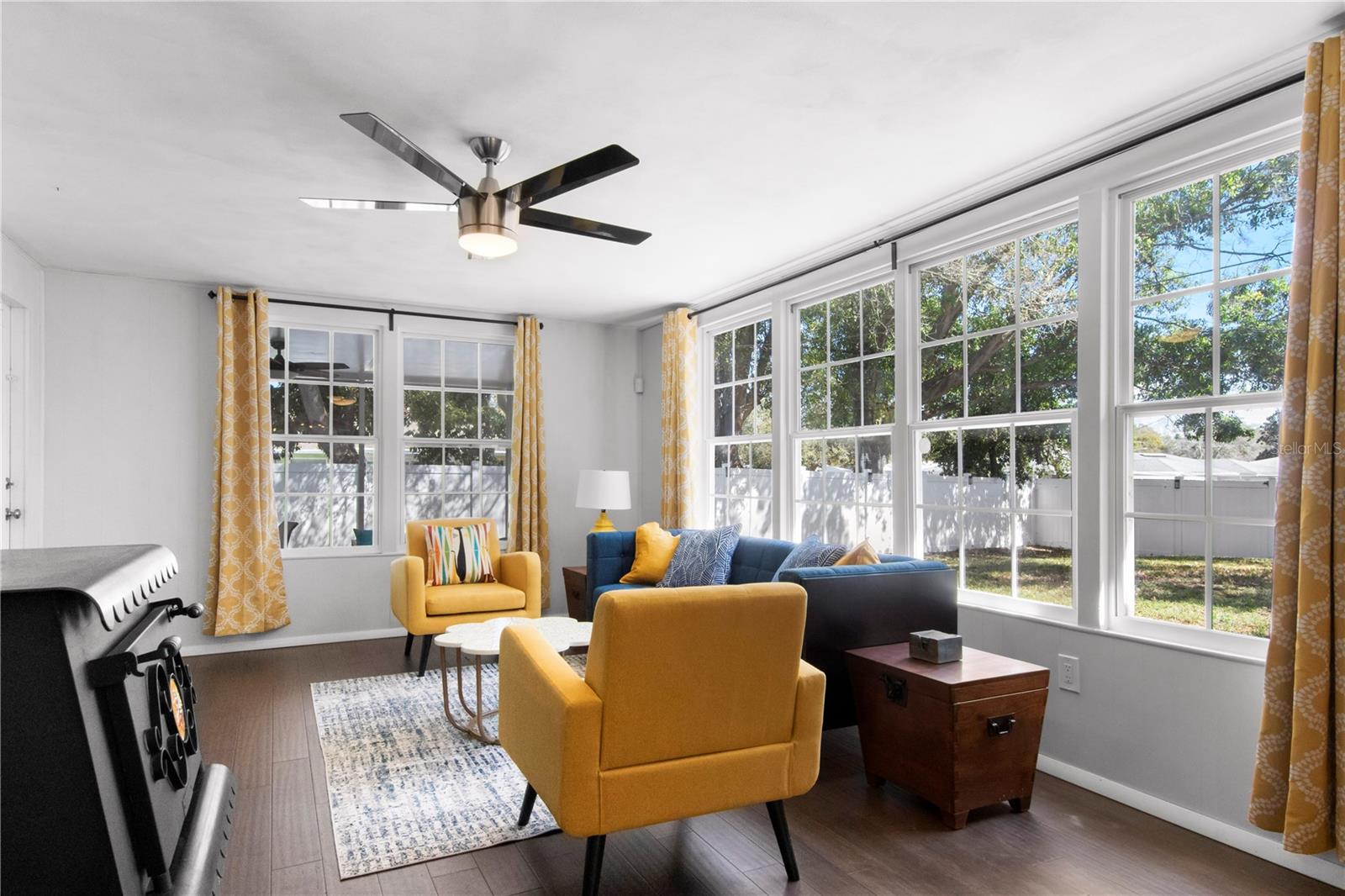 Family room overlooks large fenced backyard and the screened patio.