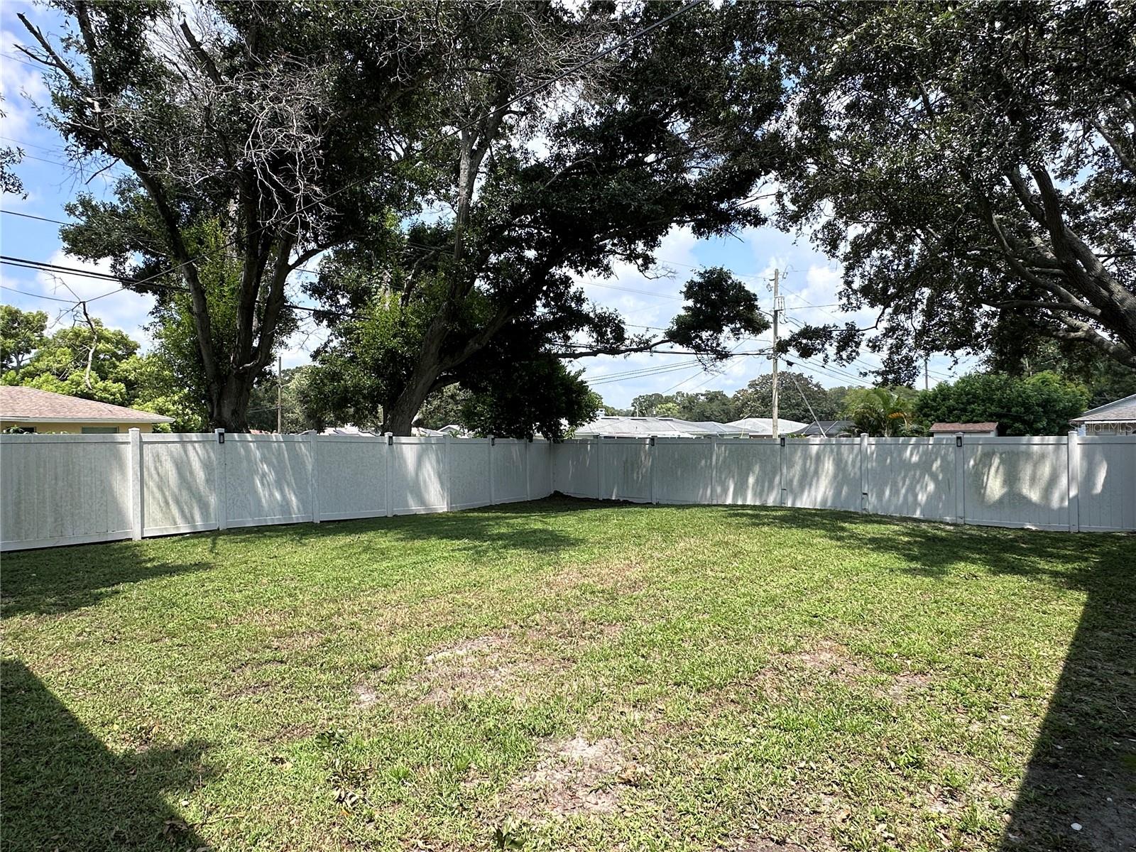 Large backyard is fully fenced in.