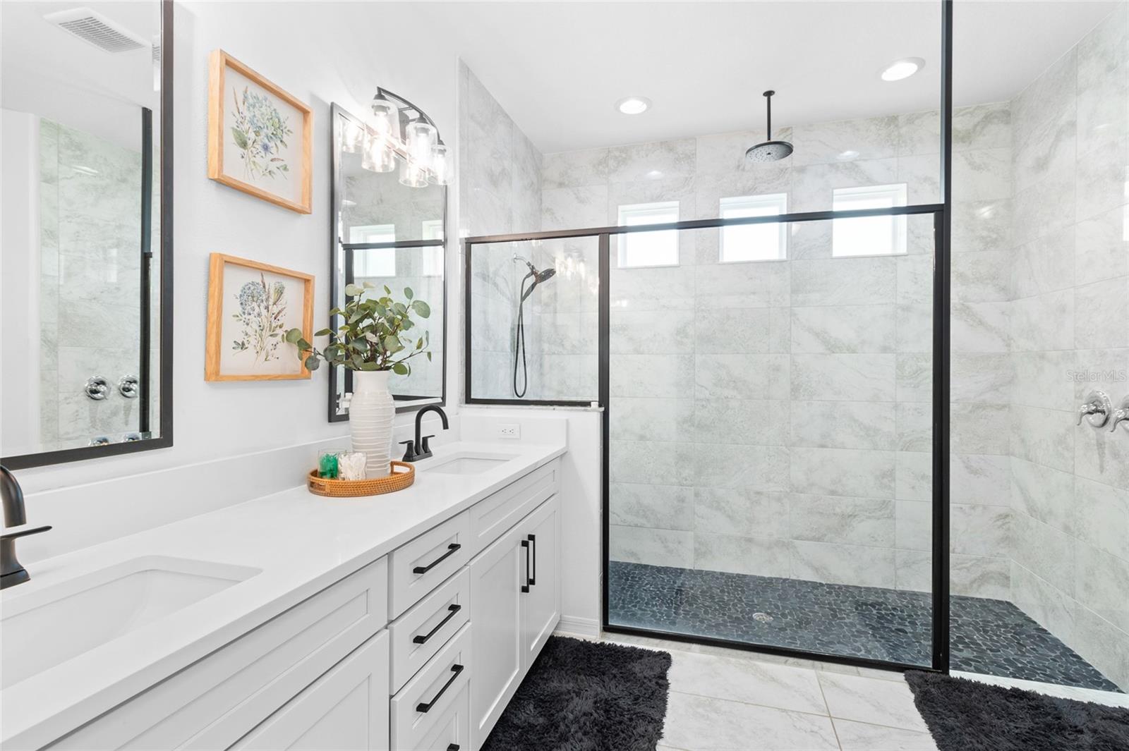 Dual sinks and waterfall shower