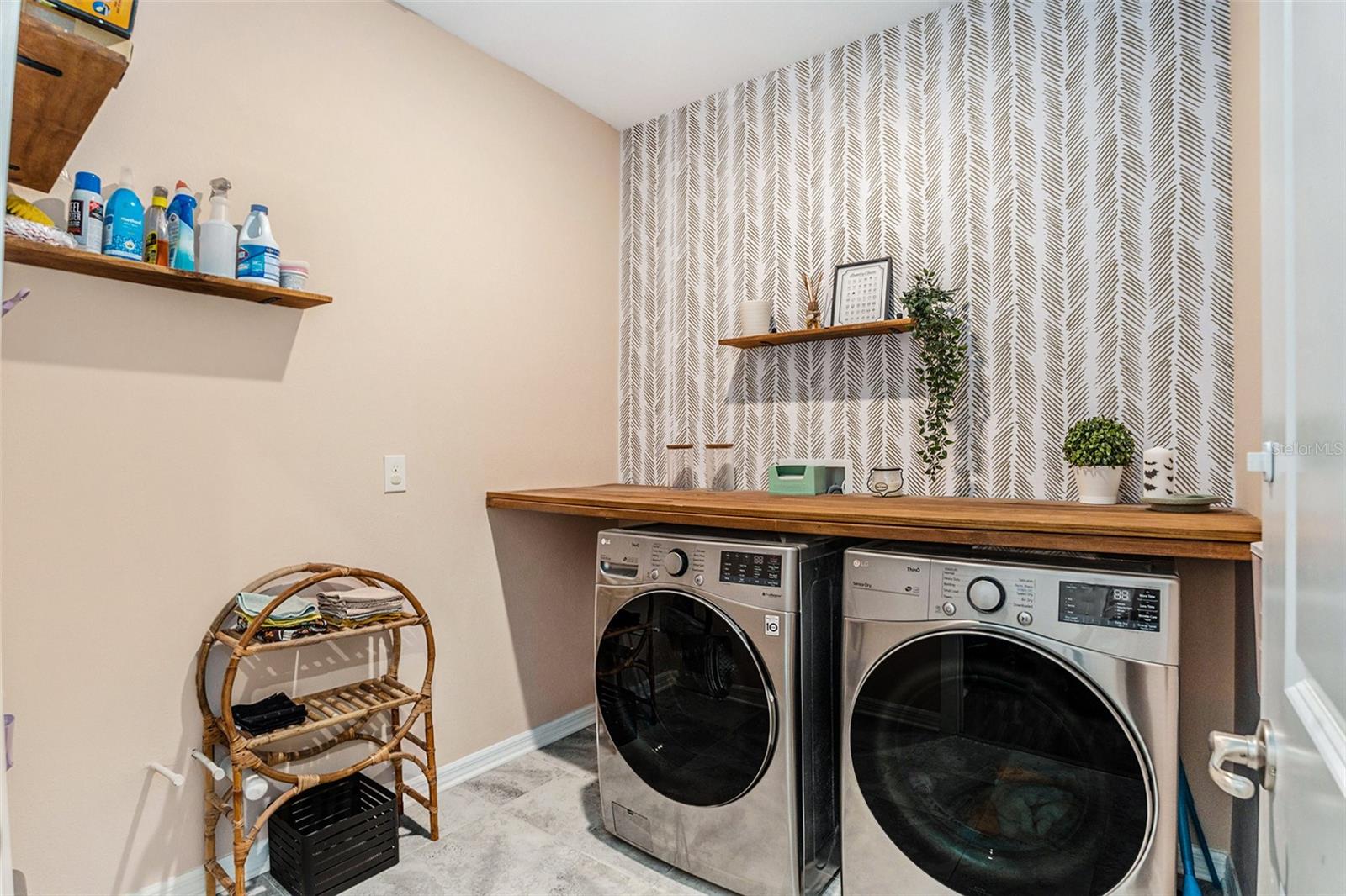 SPACIOUS LAUNDRY ROOM.