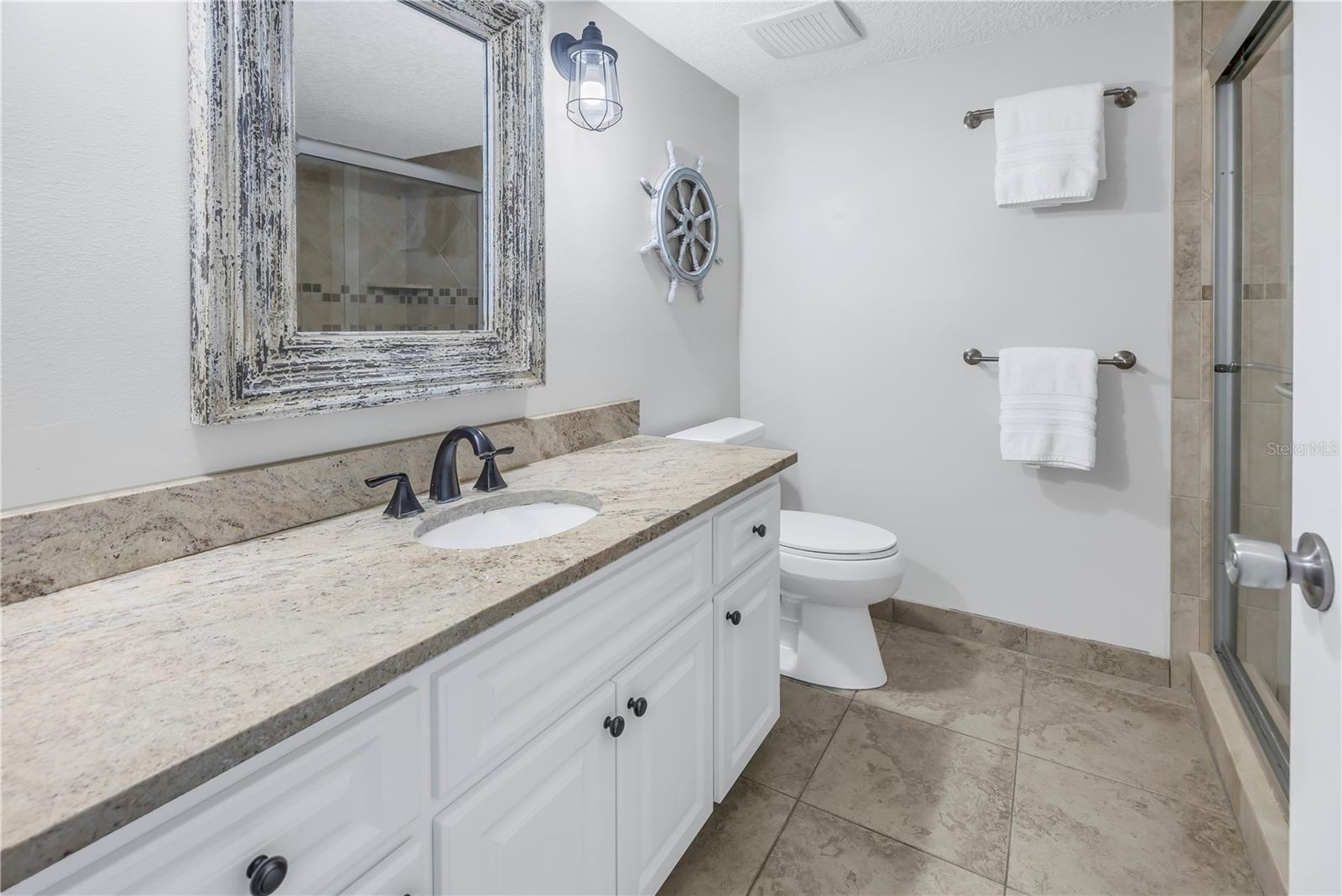 Ensuite Primary bathroom with granite counter