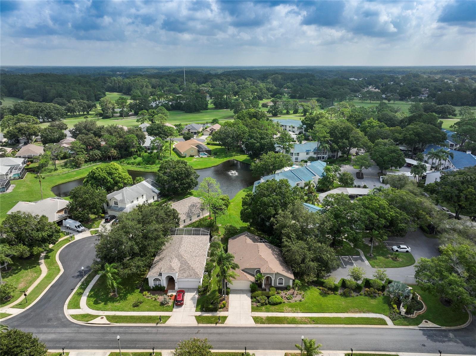 Aerial View of home with pond in the back