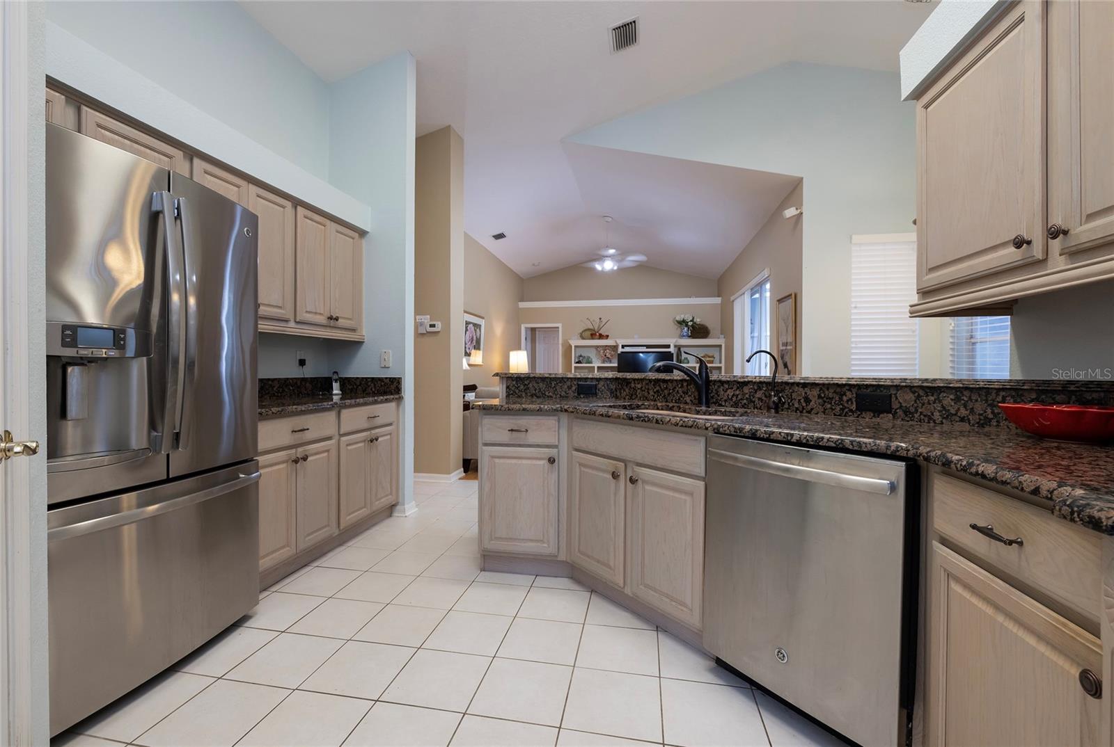 Kitchen with Stainless appliances, granite and wood cabinets