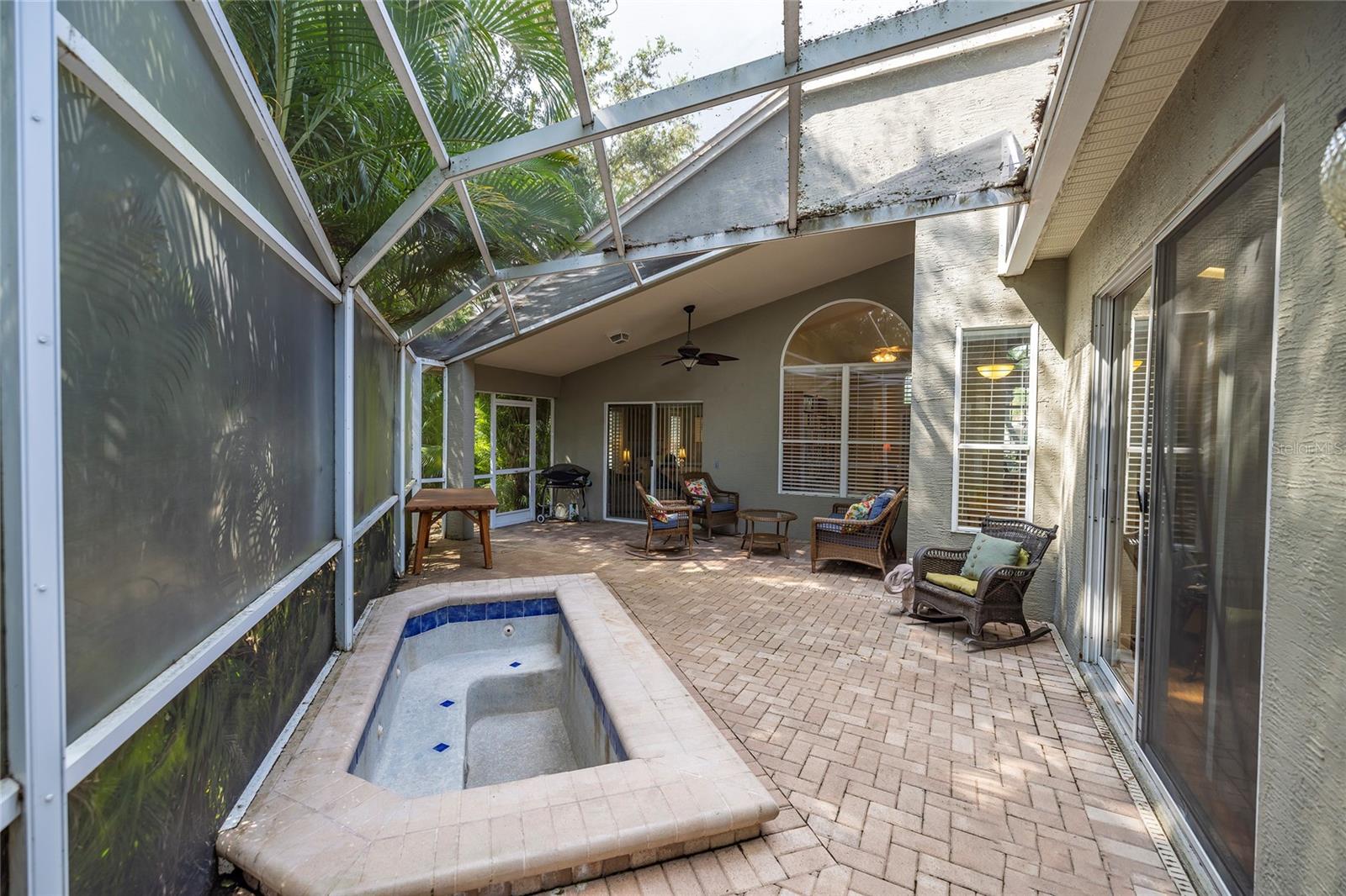 Paved, screened patio with Spa