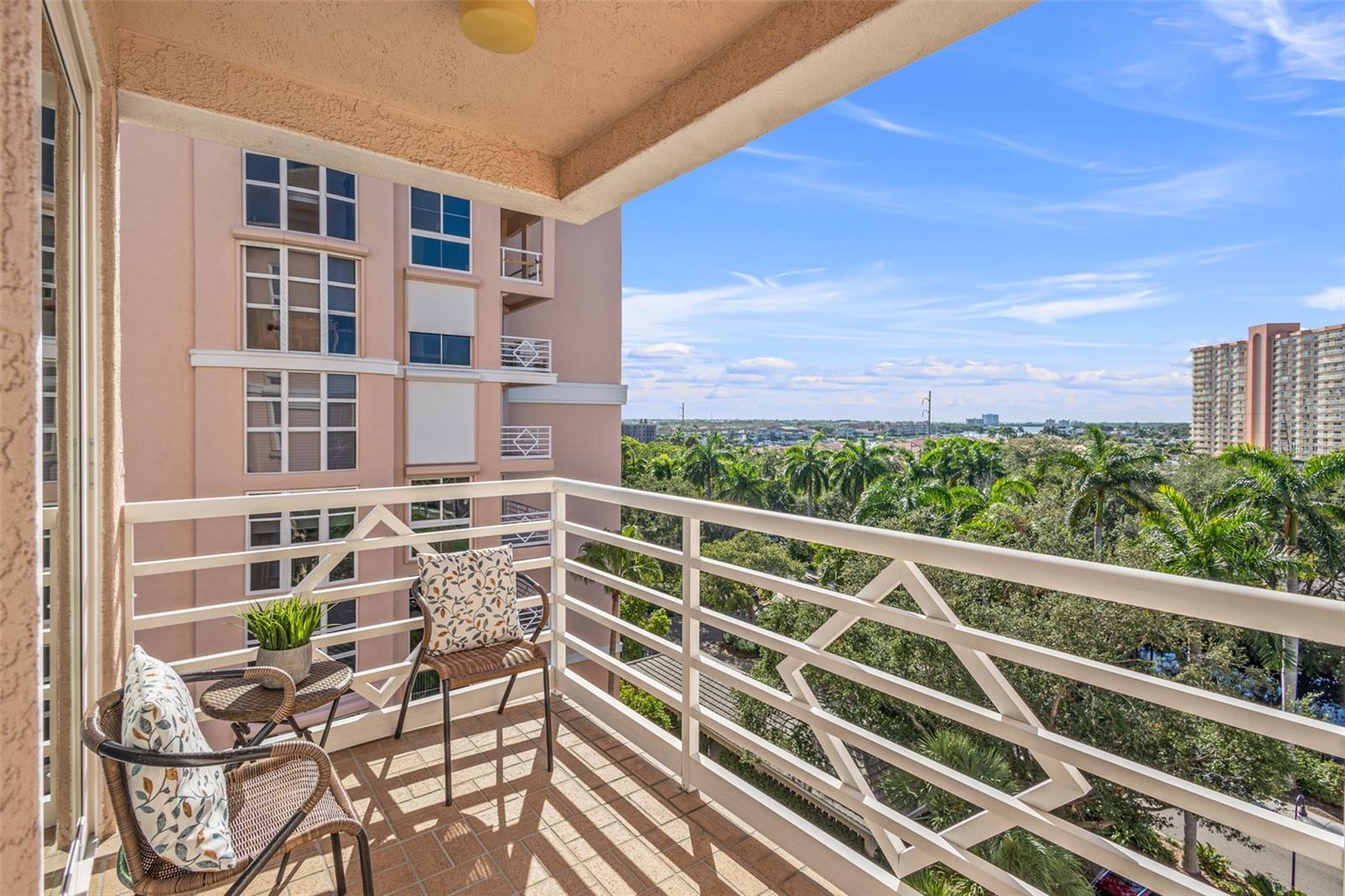 Front balcony is large enough for a bistro table and two chairs.