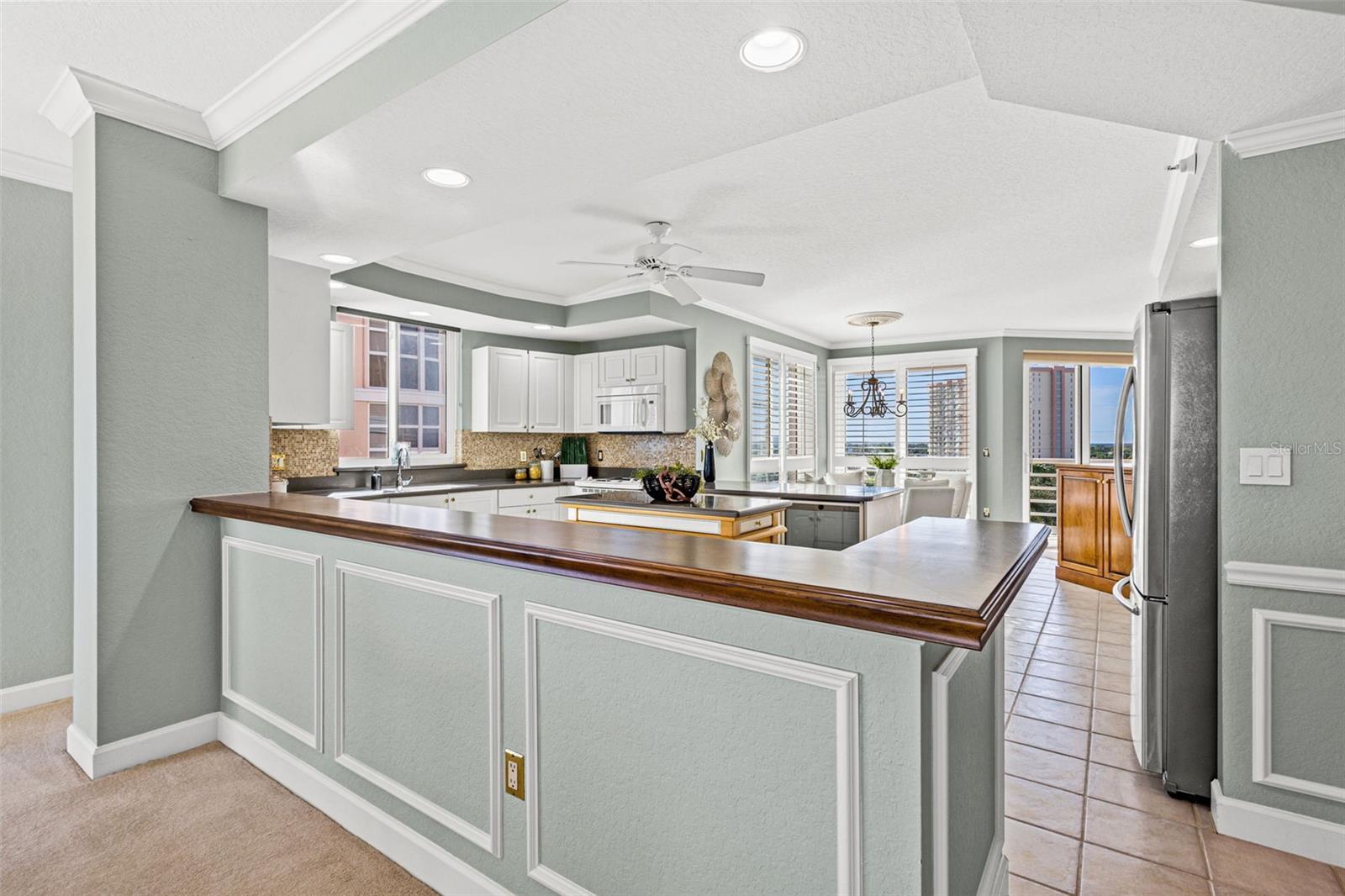 Kitchen is open to the dining and living room, creating a bright space throughout.