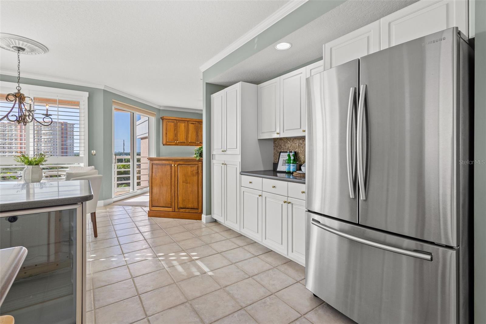 Extra cabinets along the fridge wall are perfect for holiday decor and large appliances.