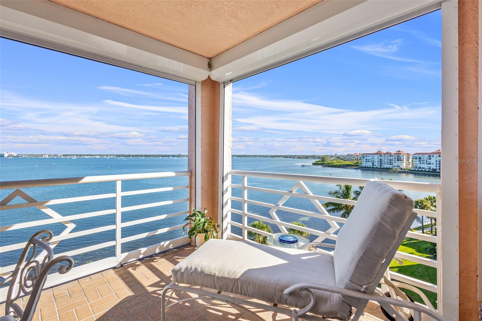 Terrace facing the bay is large enough for a table of 4 and a lounge chair.