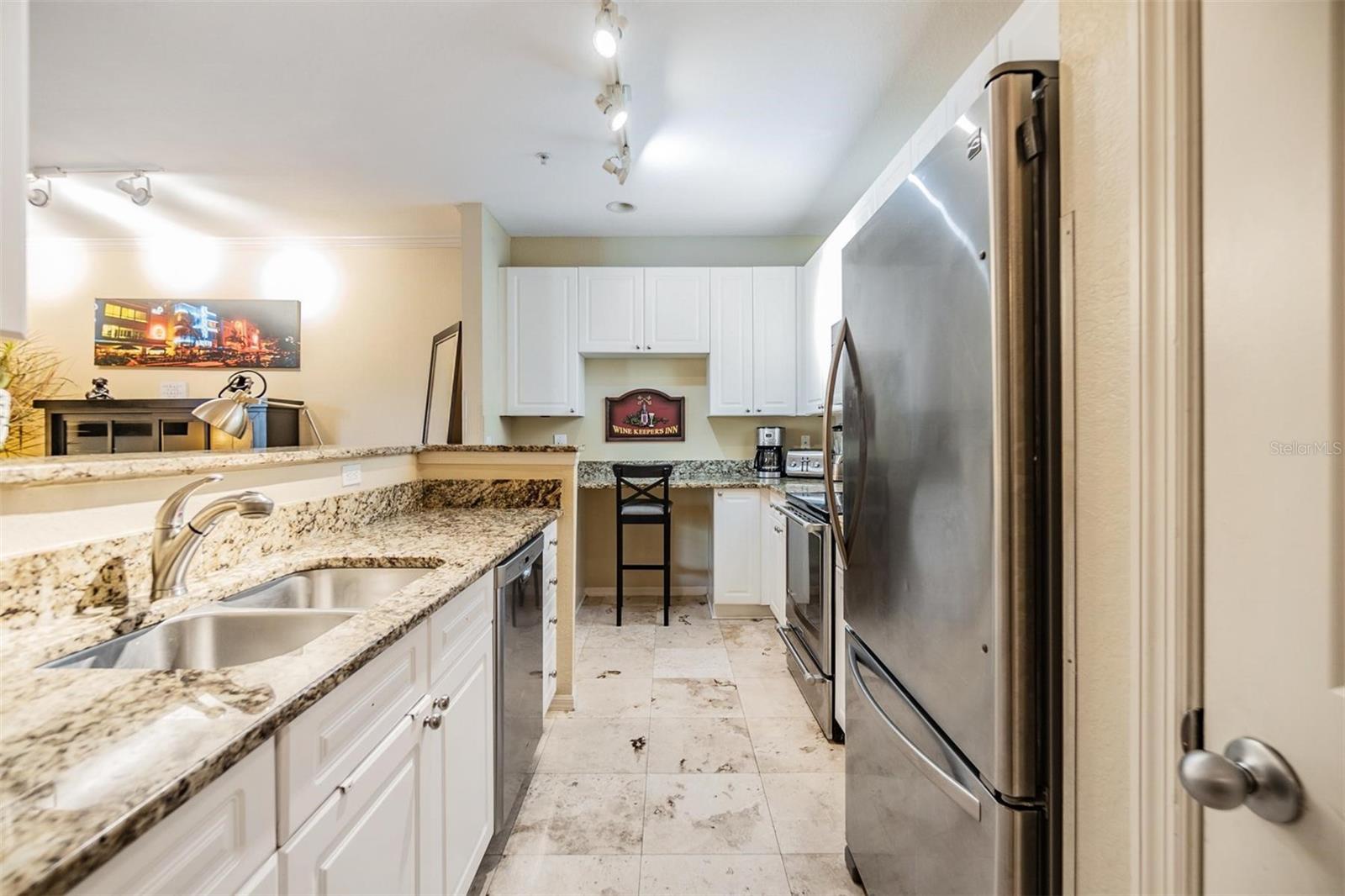 Granite countertops and stainless appliances.