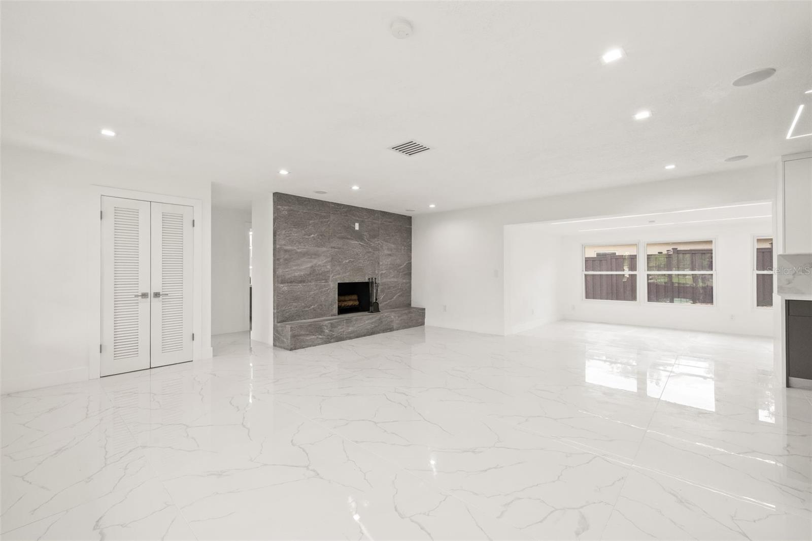 Walk into Open Concept Living with stunning fireplace.