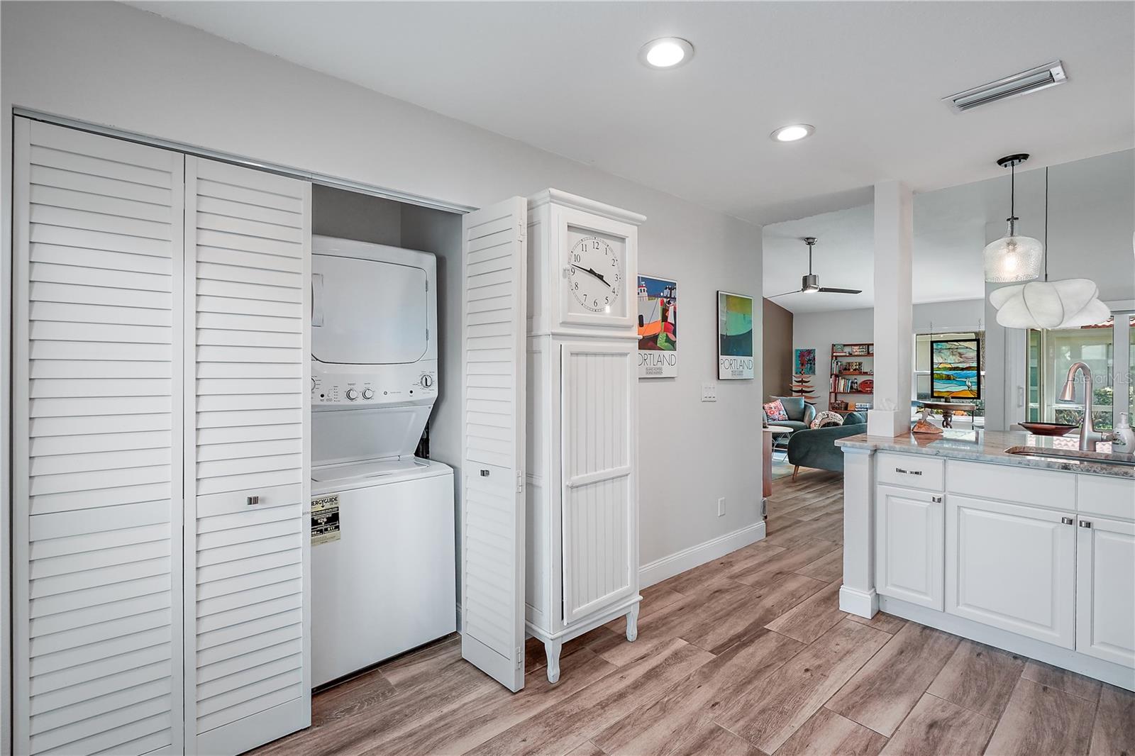 Kitchen furnished with built in cabinetry.  The condo is no longer furnished; however the washer and dryer remain as they are conveying with the property.