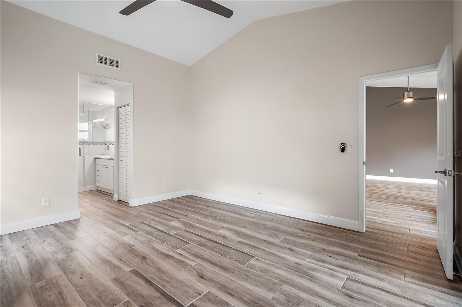 Unfurnished master bedroom.  The opening towards the left leads into the ensuite bathroom, the water closet and the linen closet and the  walk-in closet.