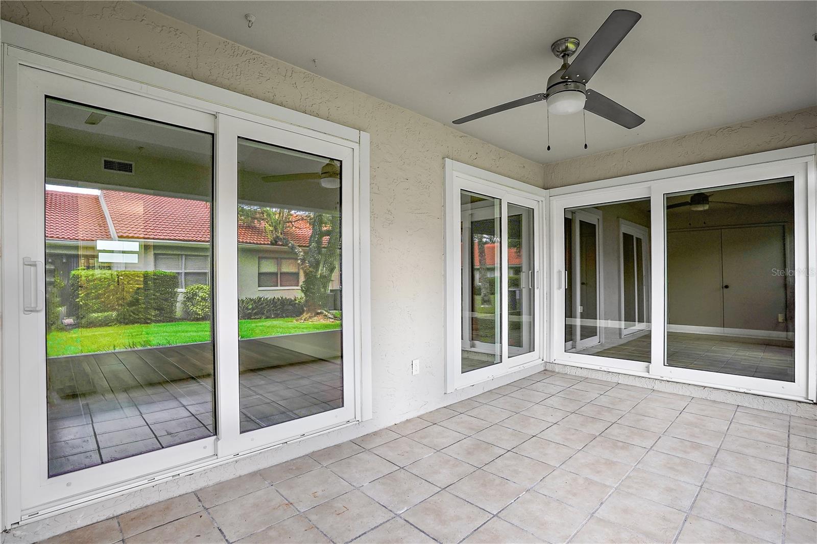 Unfurnished back screened patio (storage closet not shown in photo)