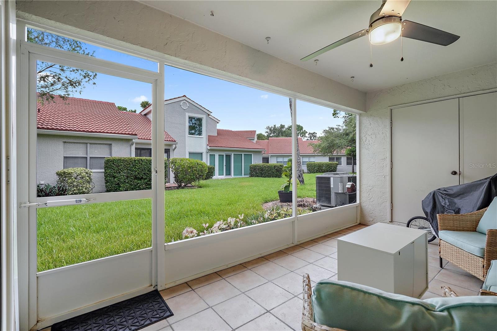 view from back patio with some furnishings - condo currently unfurnished