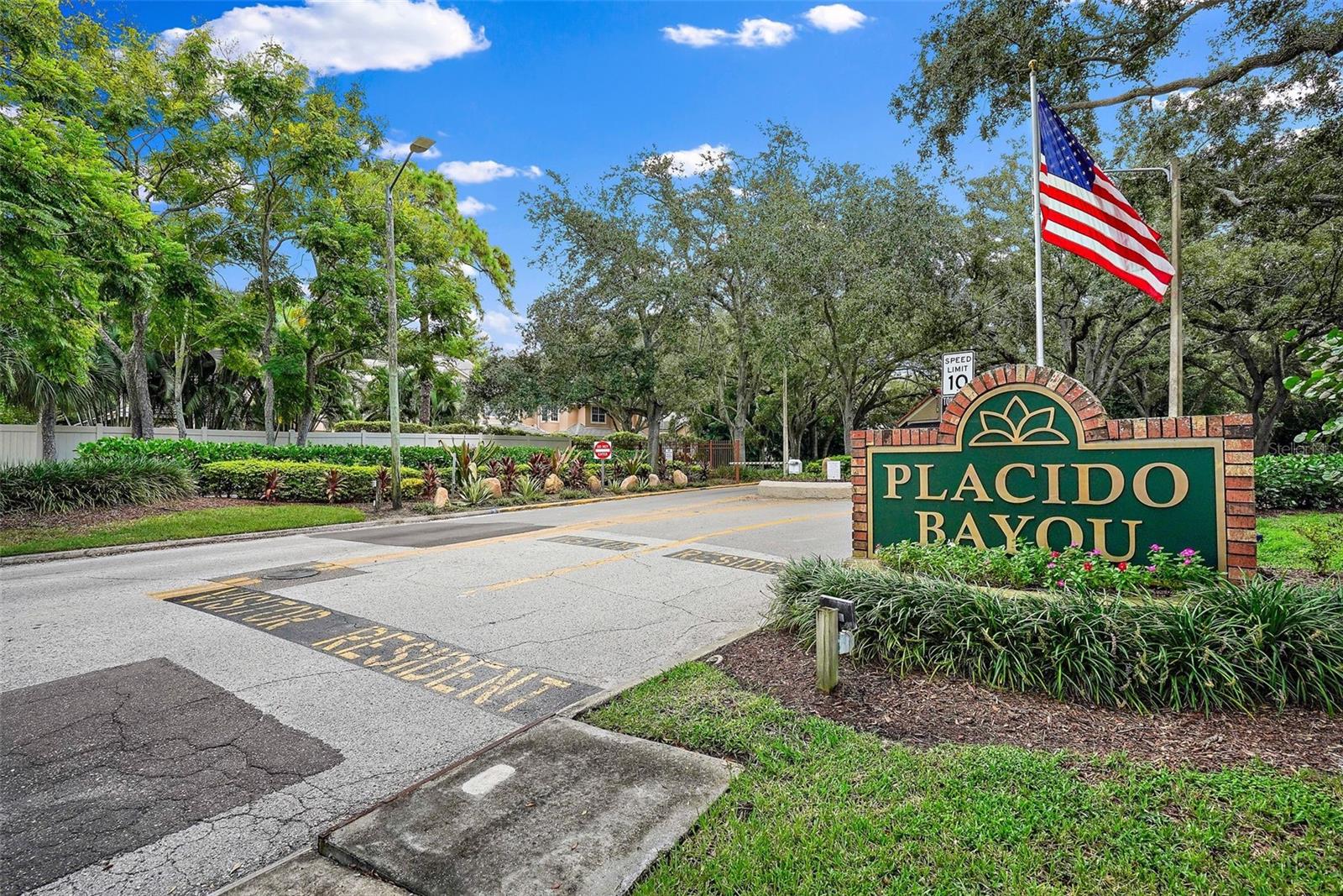 Entryway to Placido Bayou community.  The manned gate house just behind this sign.  The security guard is present 24 hours a day, 7 days a week.