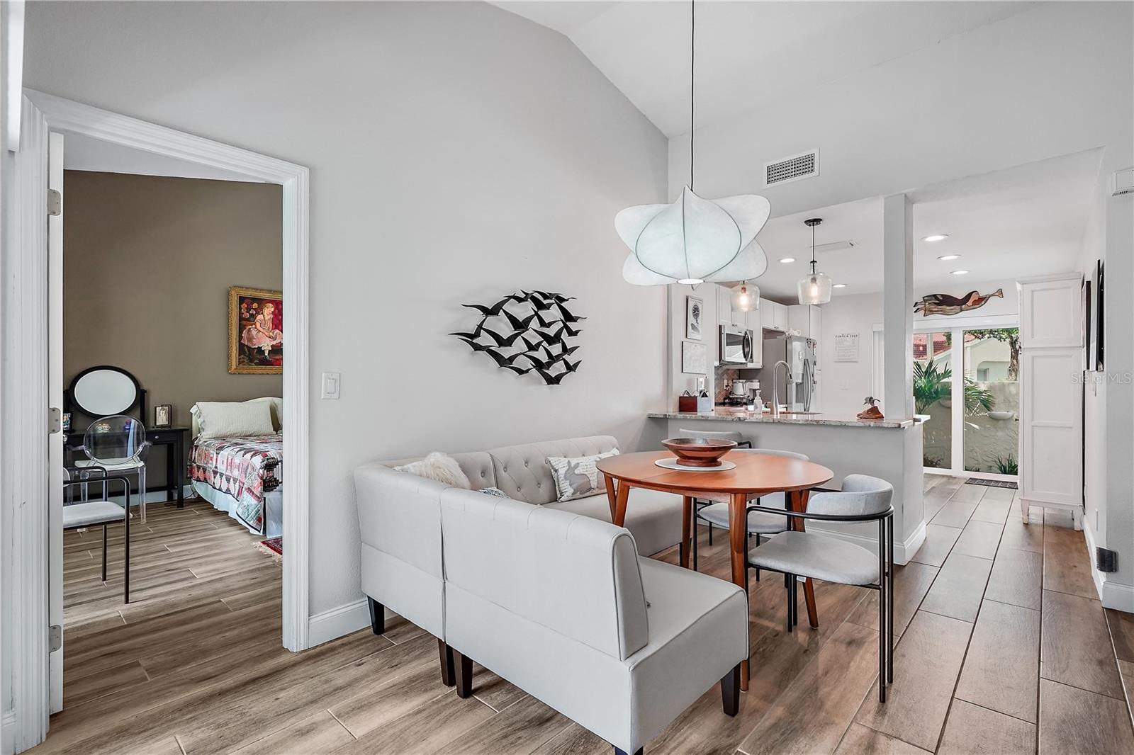 The dining area looking towards the kitchen - furnished