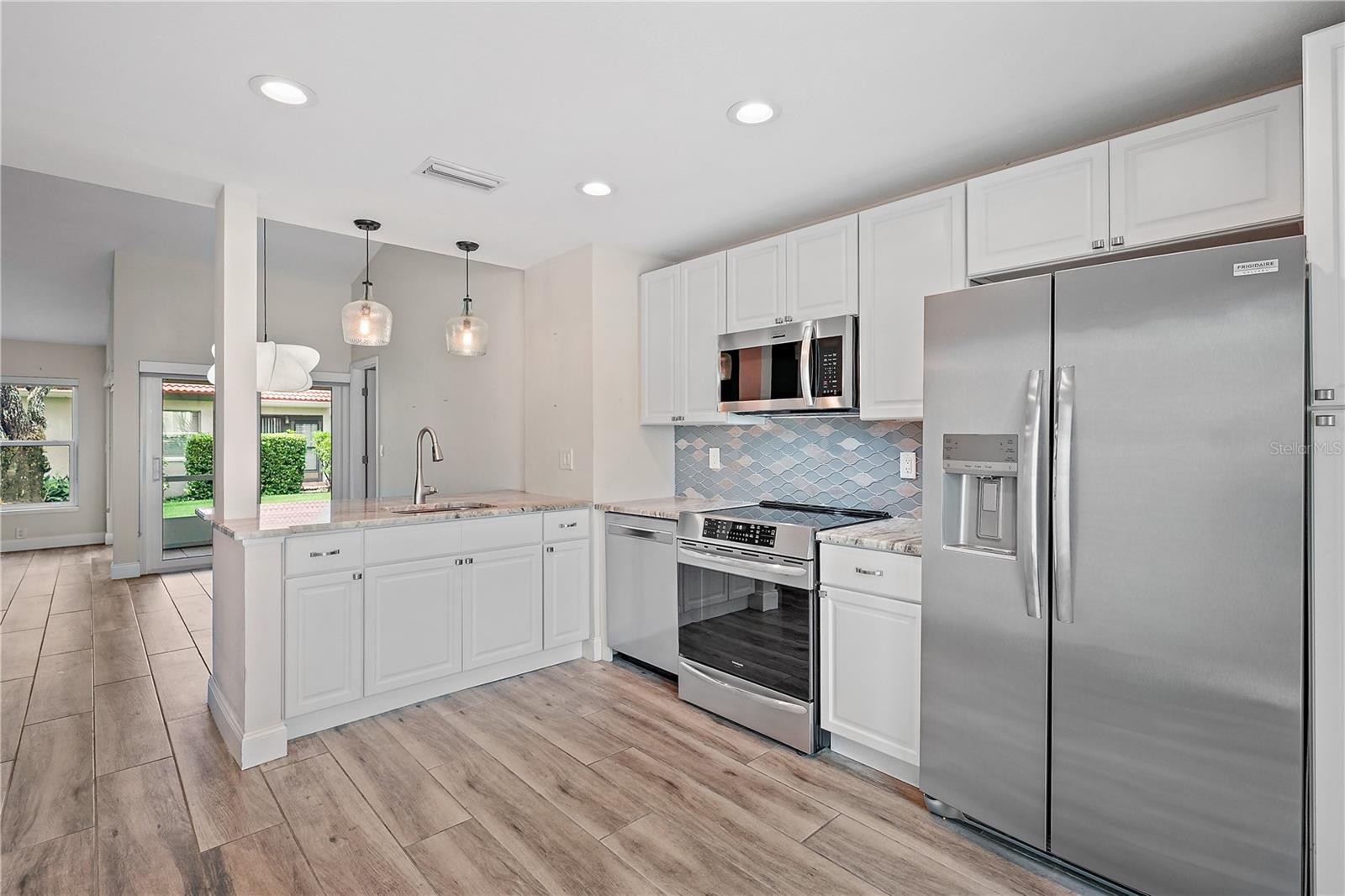 Unfurnished kitchen area with breakfast bar.